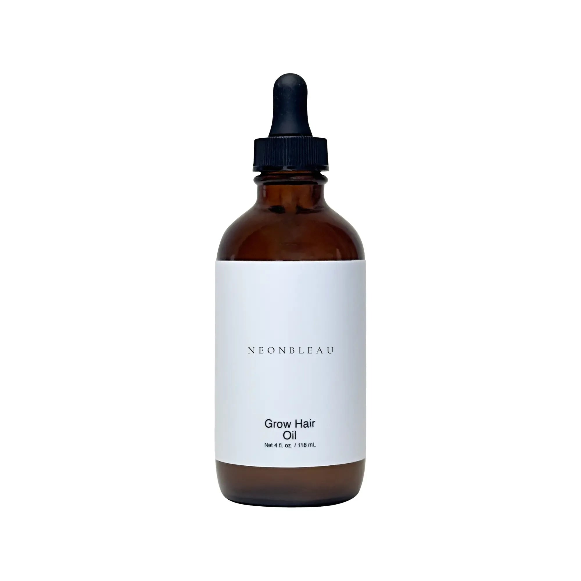 Amber glass dropper bottle of Grow Hair Oil with a white label.