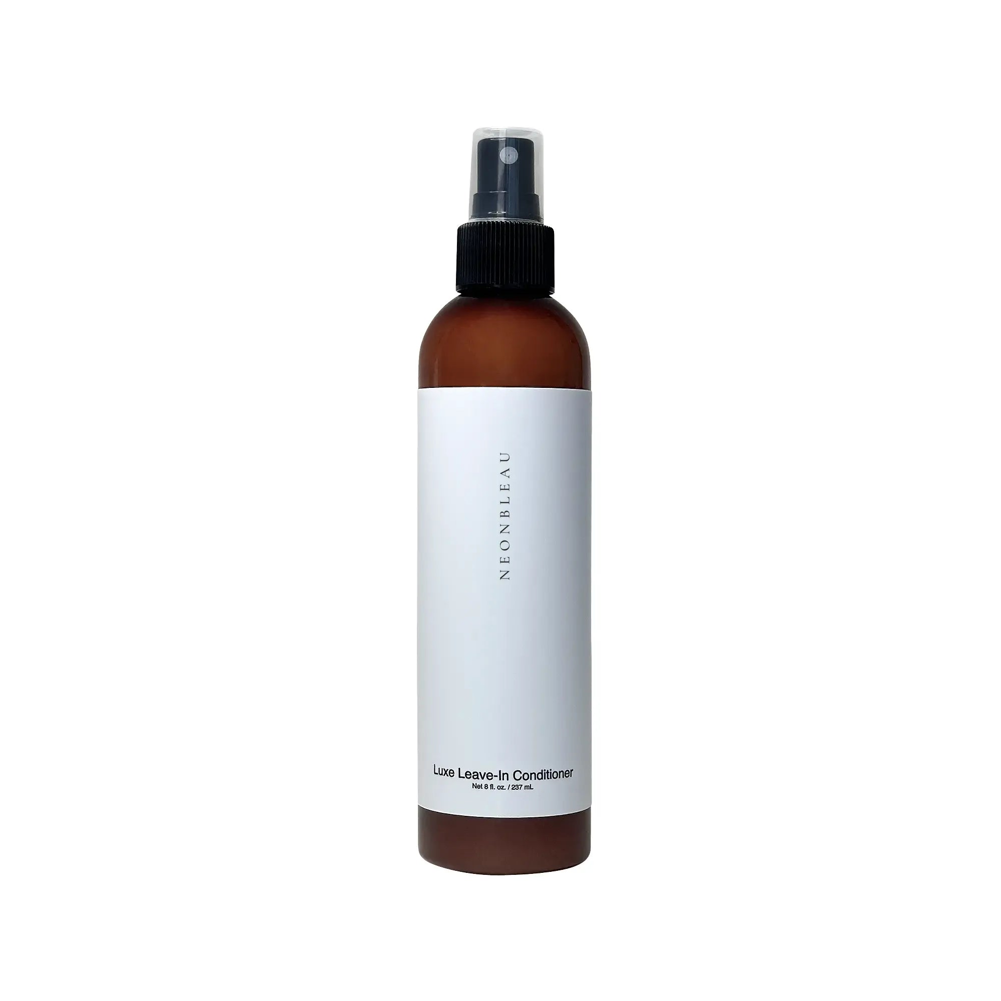 Brown spray bottle of Luxe Leave-In Conditioner with a white label.