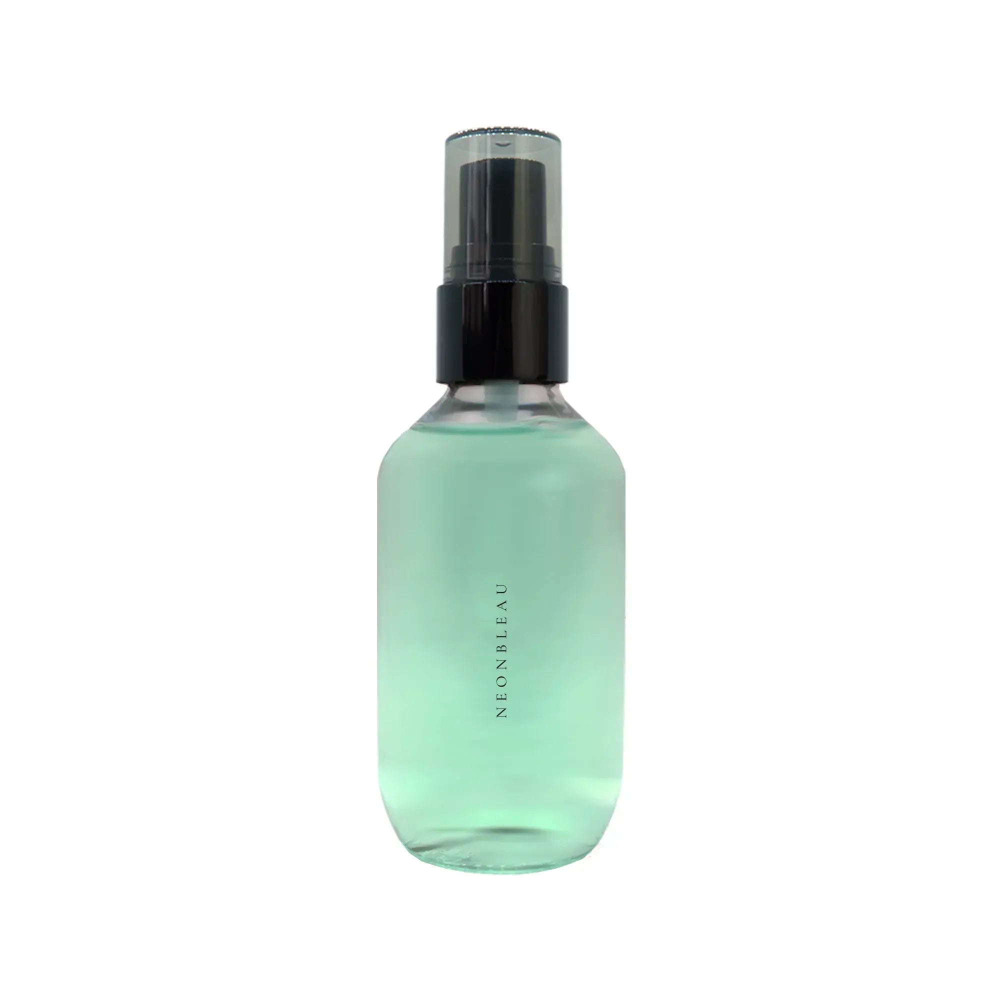A clear glass bottle of Setting Spray with a black cap and light green liquid.