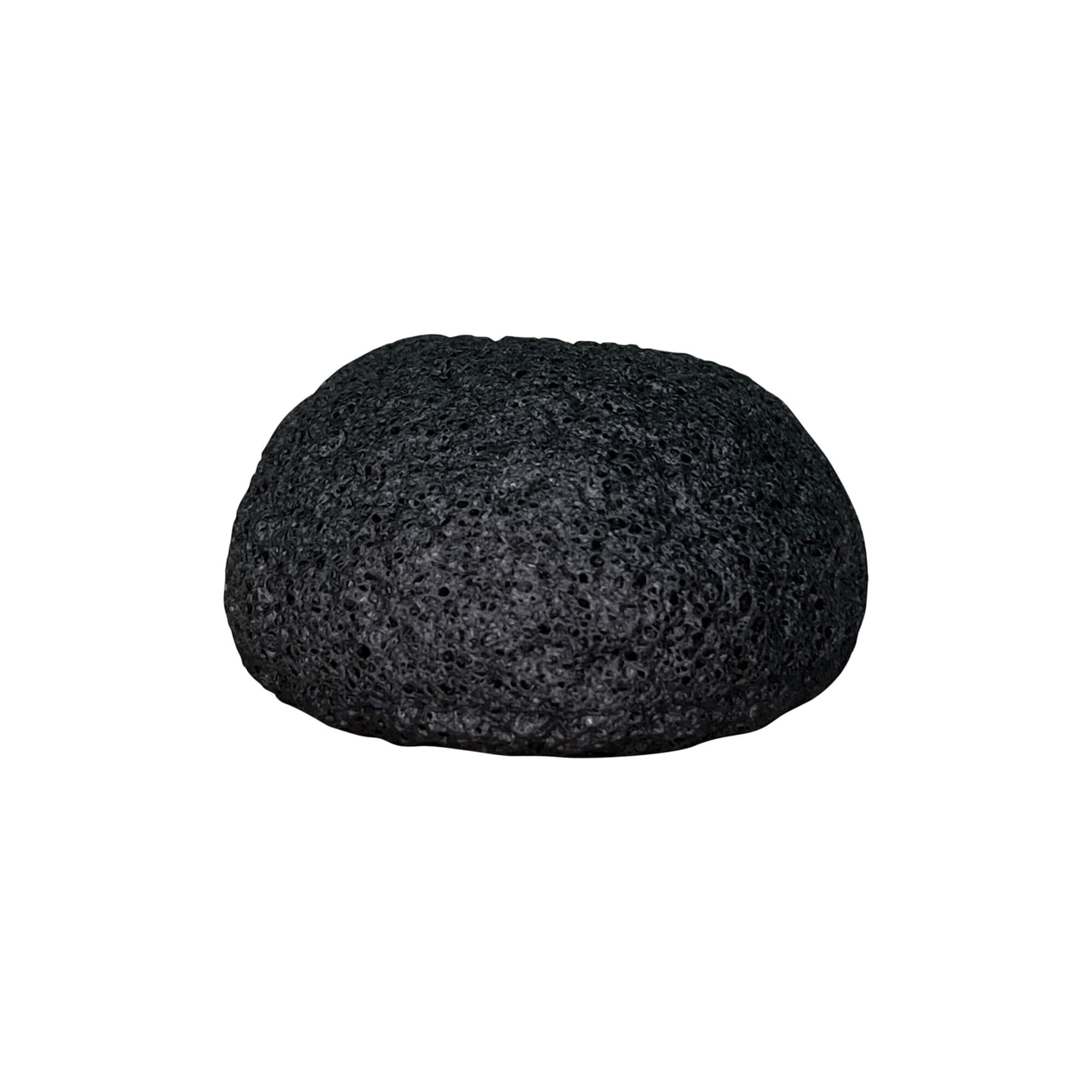 A black, rounded natural konjac sponge with a porous texture.