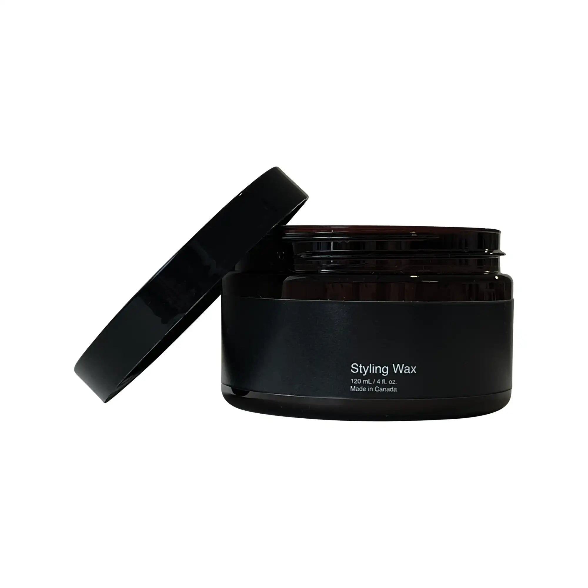 Open dark brown jar of Styling Wax with the black lid leaning against it.