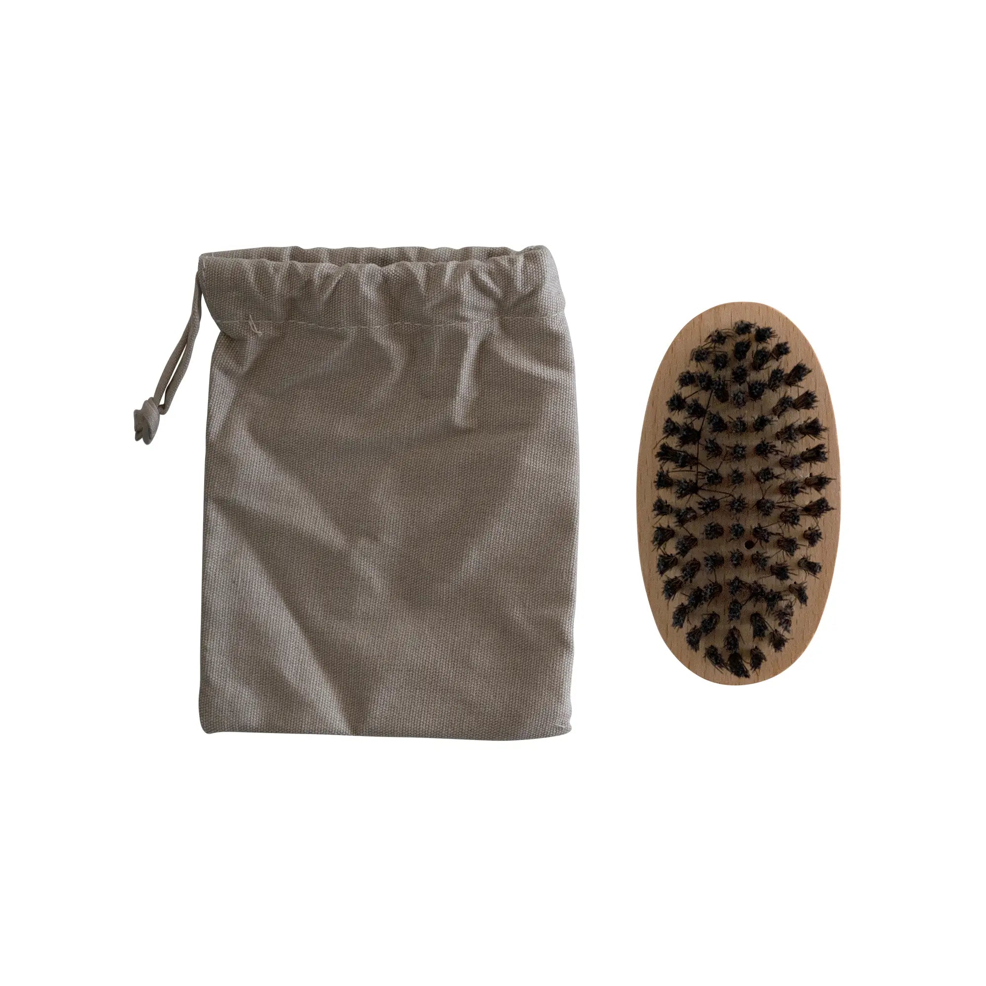 A beige drawstring pouch and an oval wooden beard brush with black bristles.