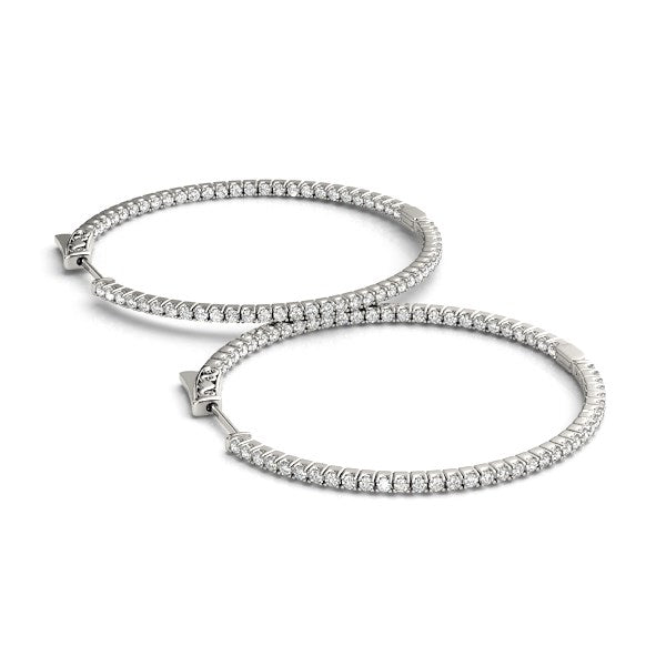 Pair of 14k white gold slim two-sided diamond hoop earrings.