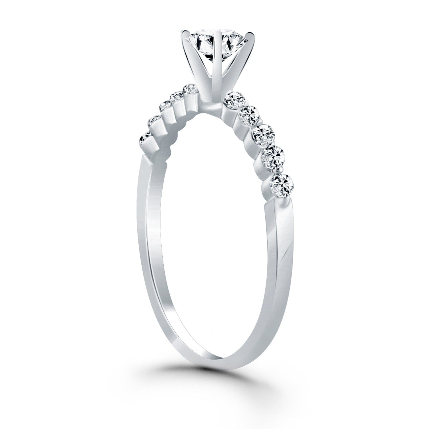 14k white gold engagement ring with a round diamond and shared prong accents.