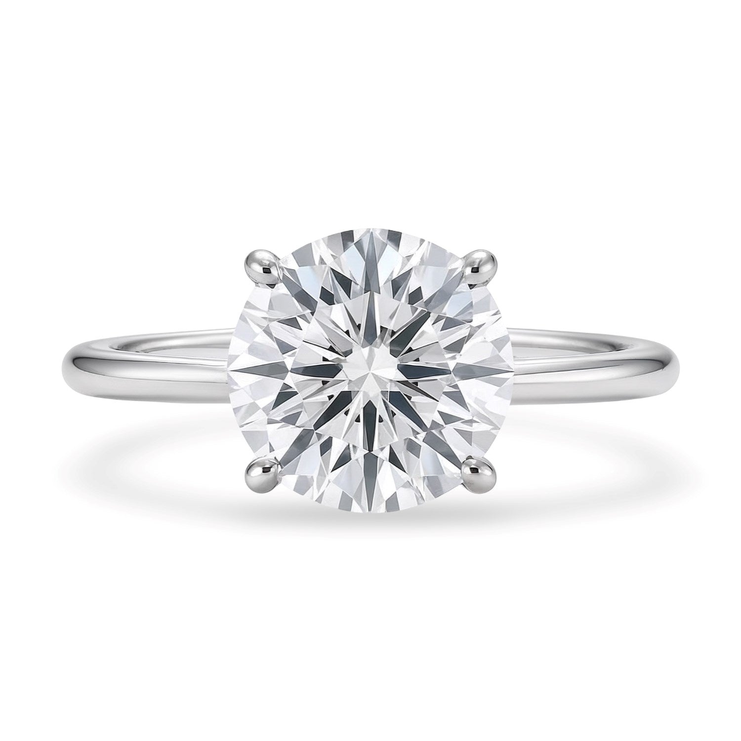 A round lab-grown diamond solitaire ring in 10K white gold with a four-prong setting.