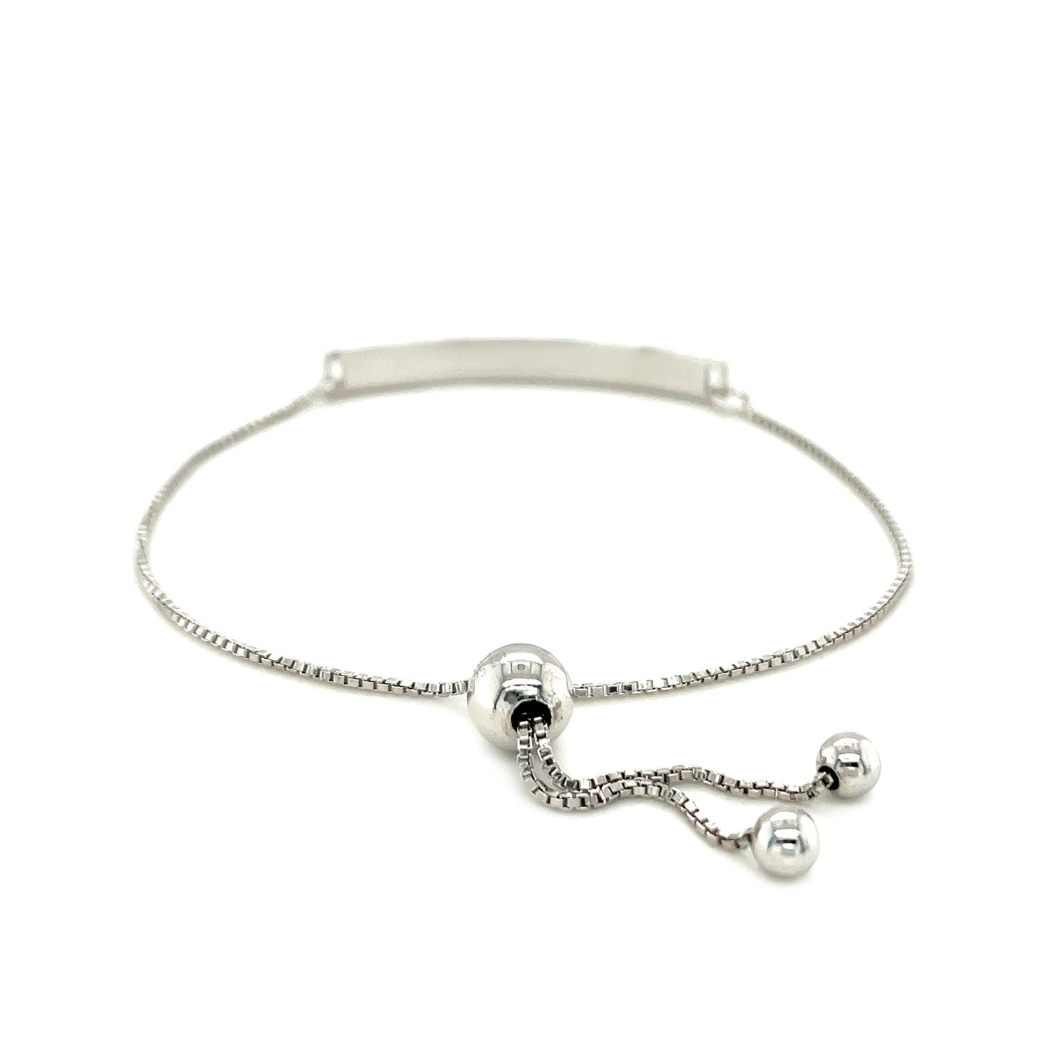 Sterling silver adjustable bracelet with a rectangular bar and two spherical charms.