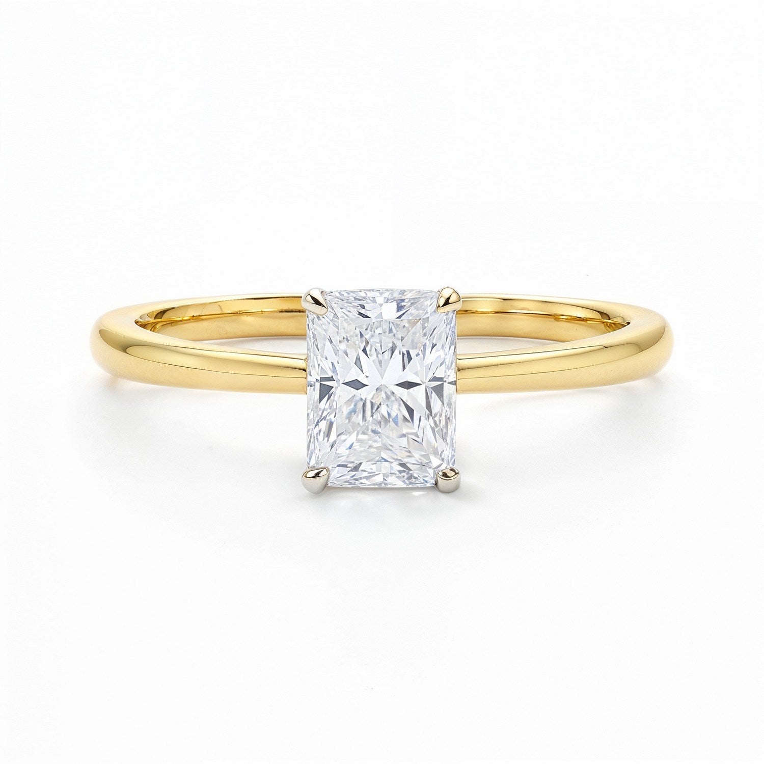 A radiant-cut lab-grown diamond solitaire ring in 14K yellow gold.