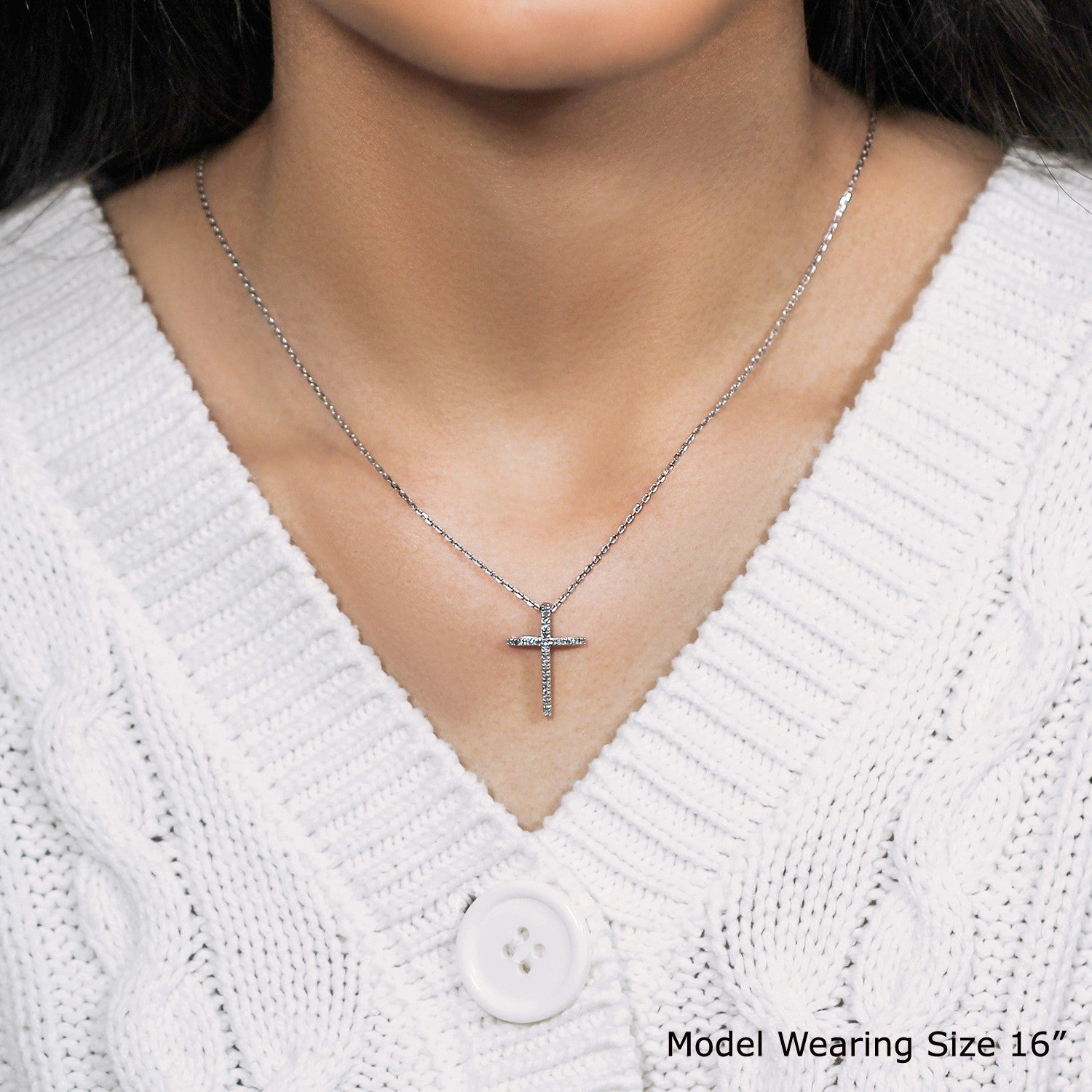 Sterling silver narrow cross pendant with diamonds on a cable chain.