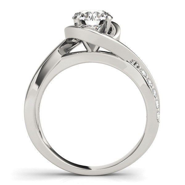 14k white gold bypass engagement ring with a round diamond and pavé accents.