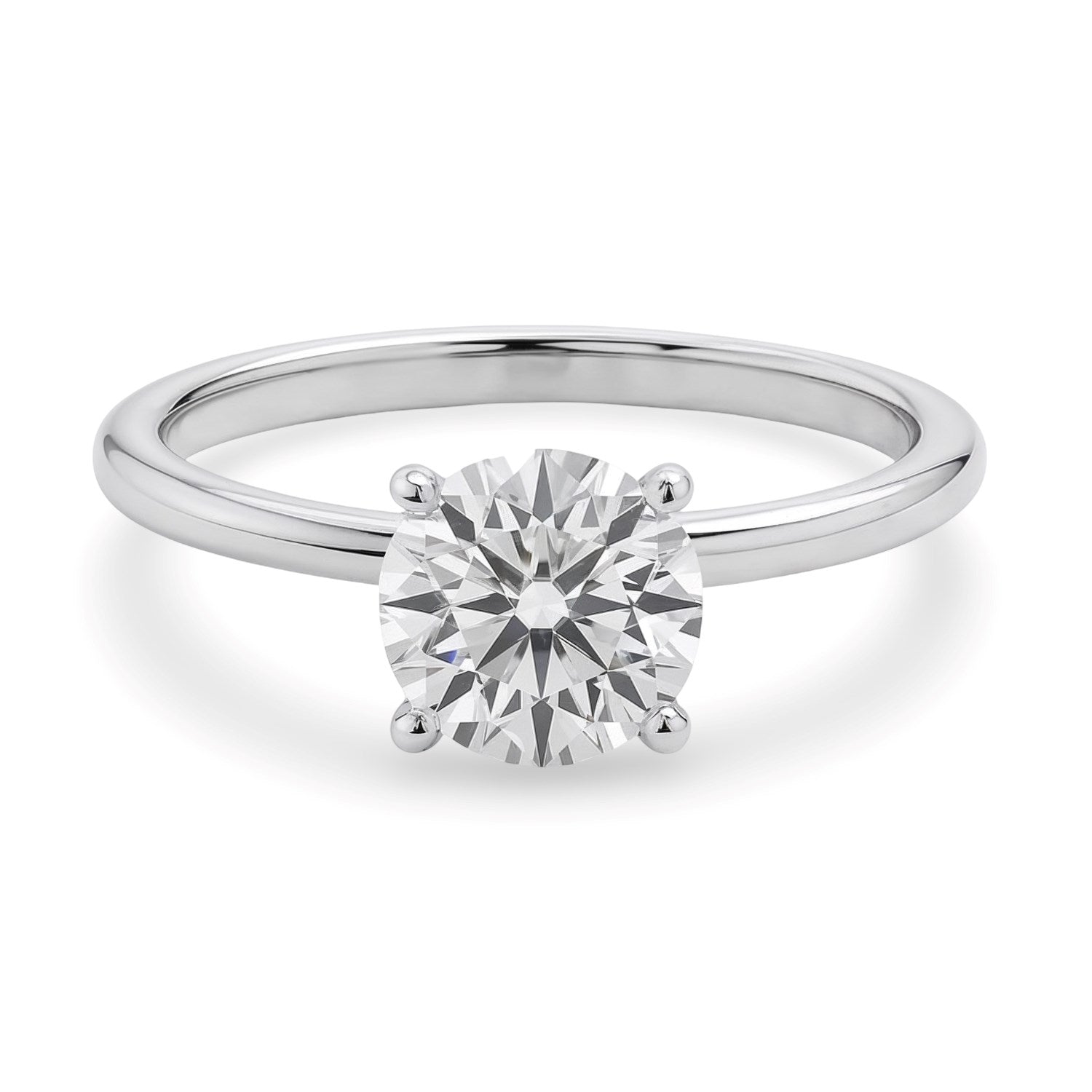 A sterling silver solitaire ring features a round lab-grown diamond in a four-prong setting.