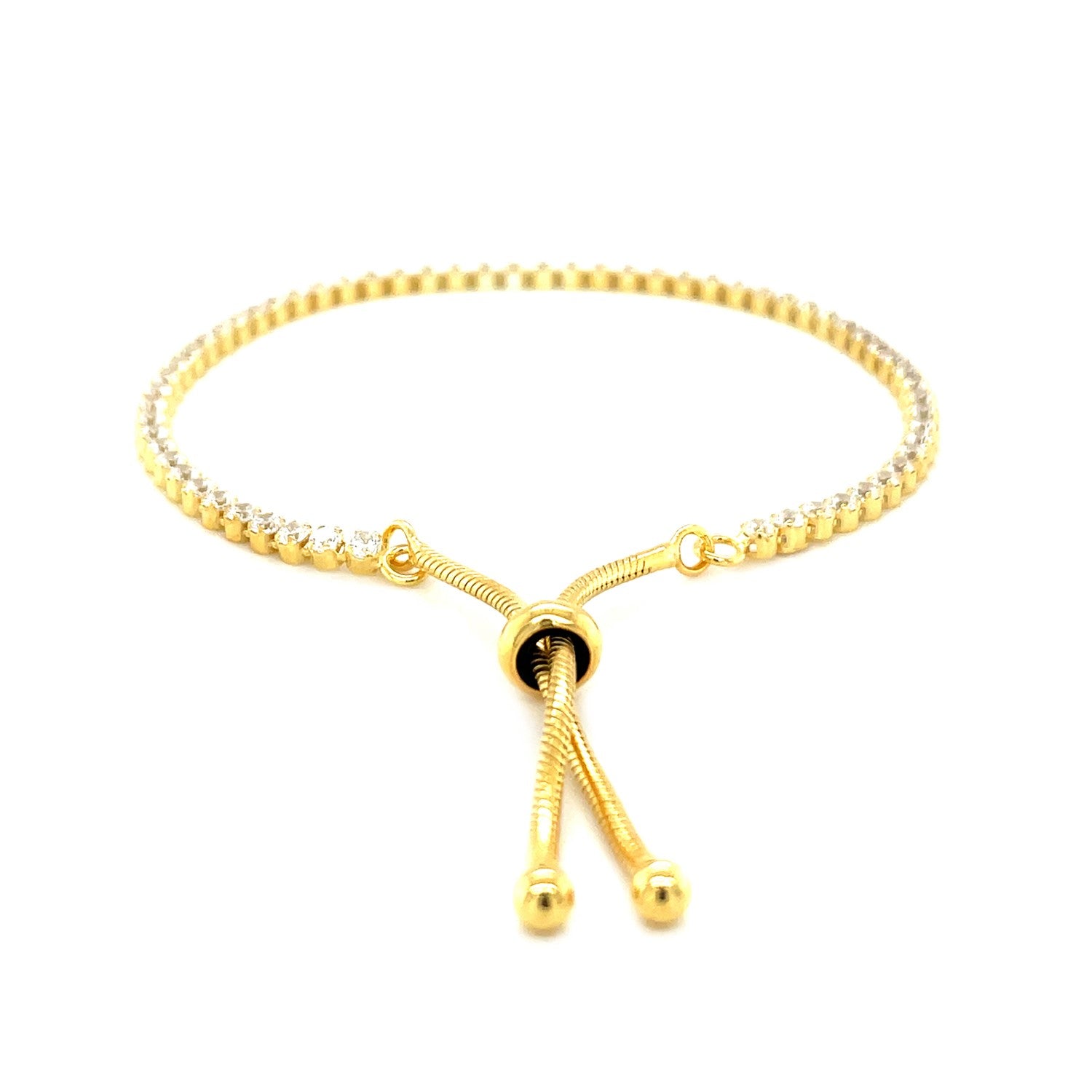 Adjustable tennis-style bracelet with cubic zirconia in yellow-toned sterling silver.