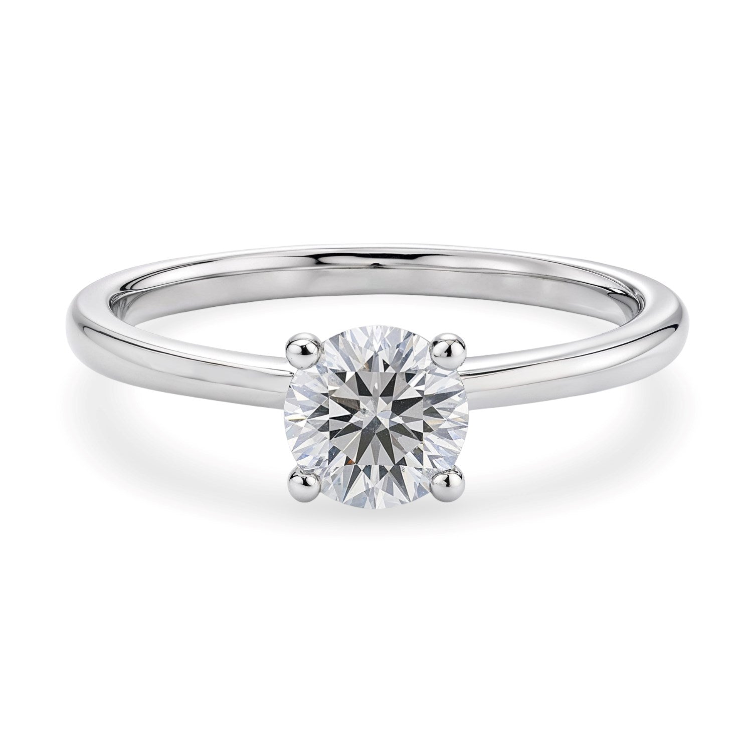 A 14K white gold solitaire ring with a round lab-grown diamond in a four-prong setting.