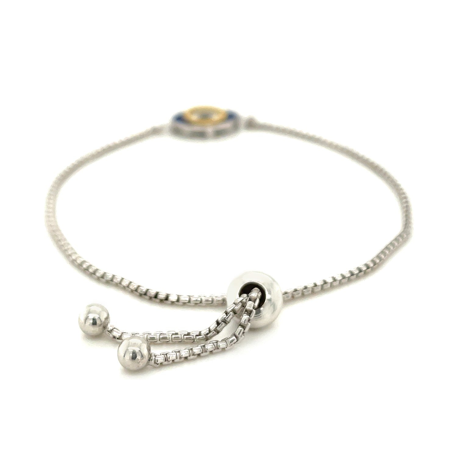 Sterling silver adjustable friendship bracelet with a two-toned enameled evil eye charm.
