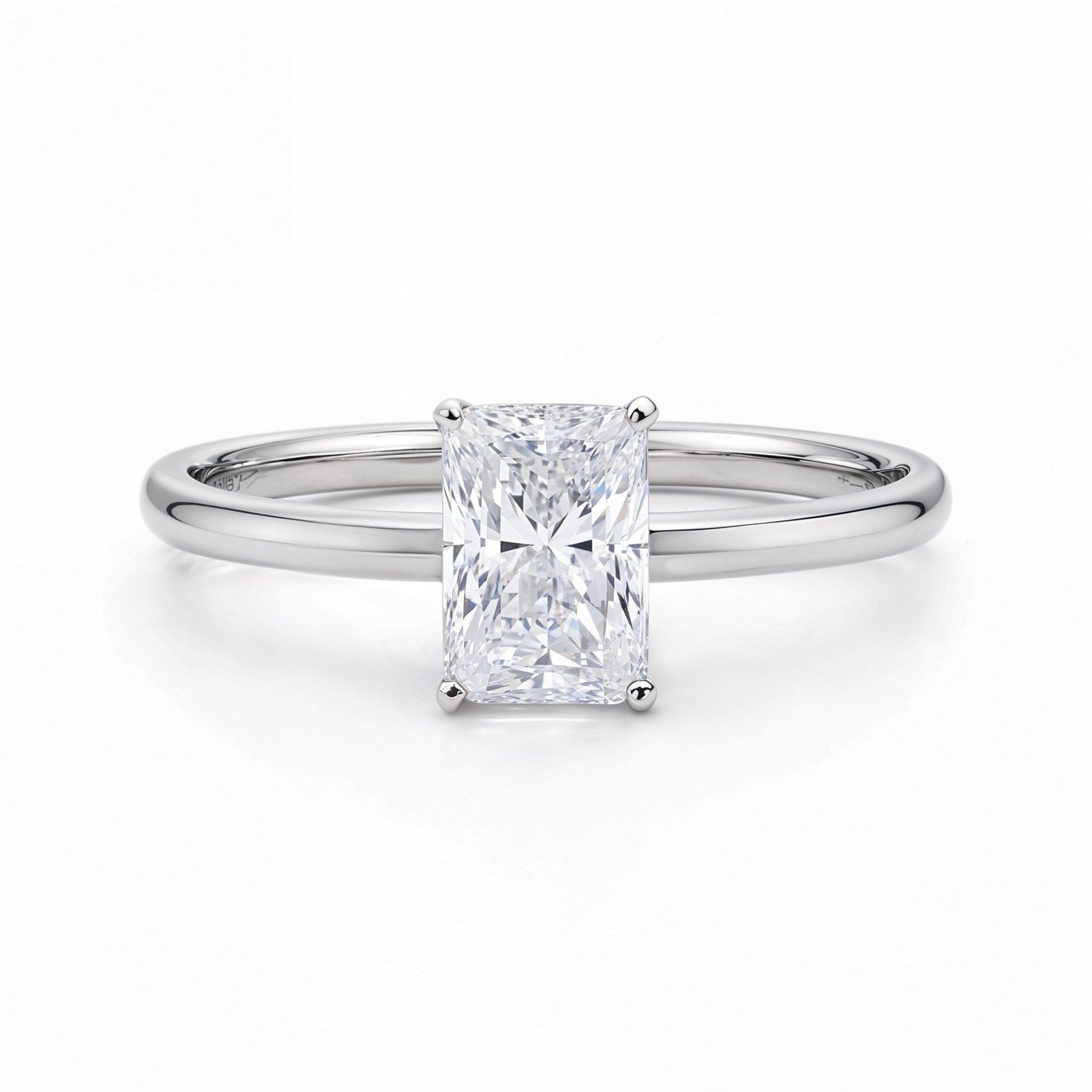 A radiant lab-grown diamond solitaire ring in 14K white gold.