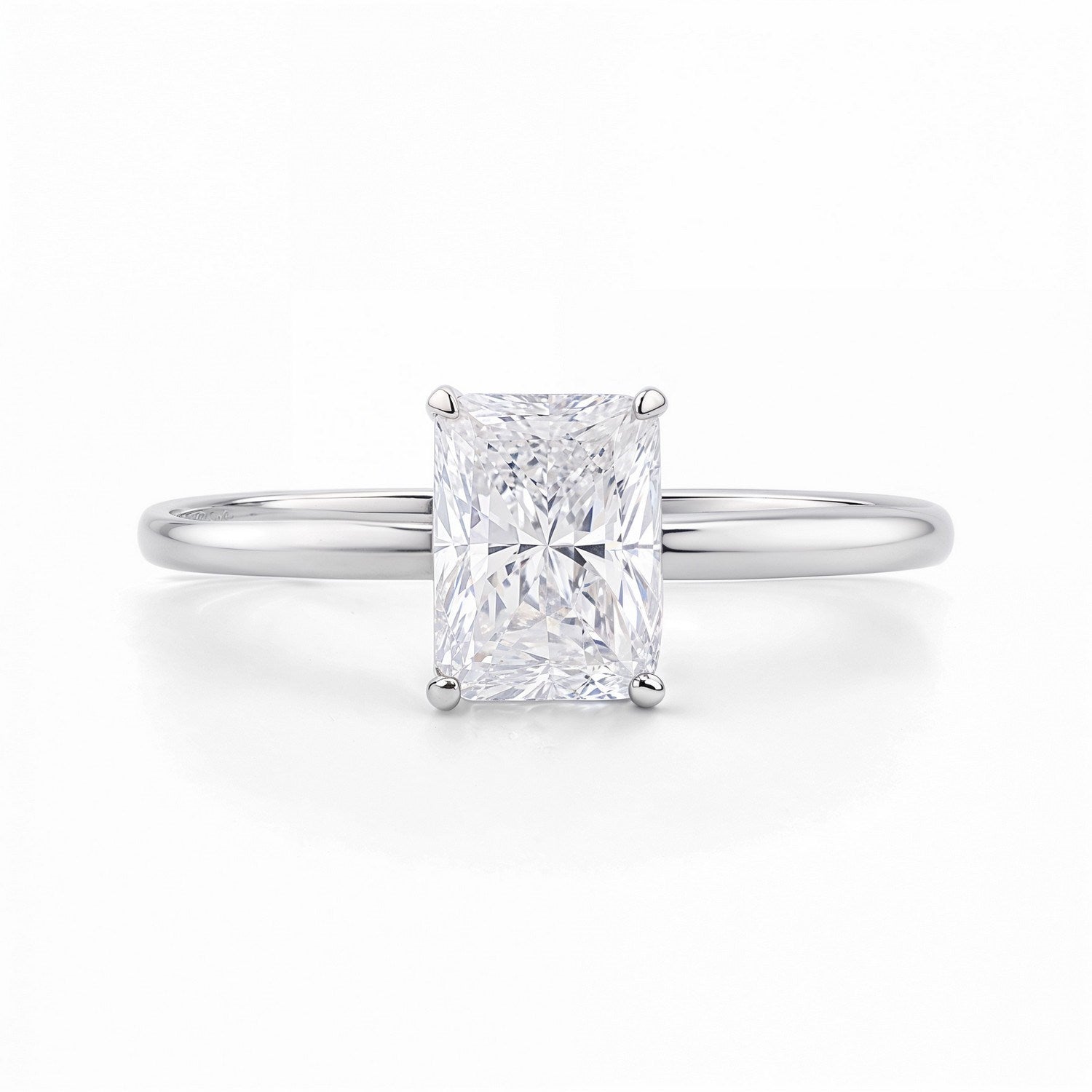 Radiant lab-grown diamond solitaire ring in 10K white gold with a four-prong setting.