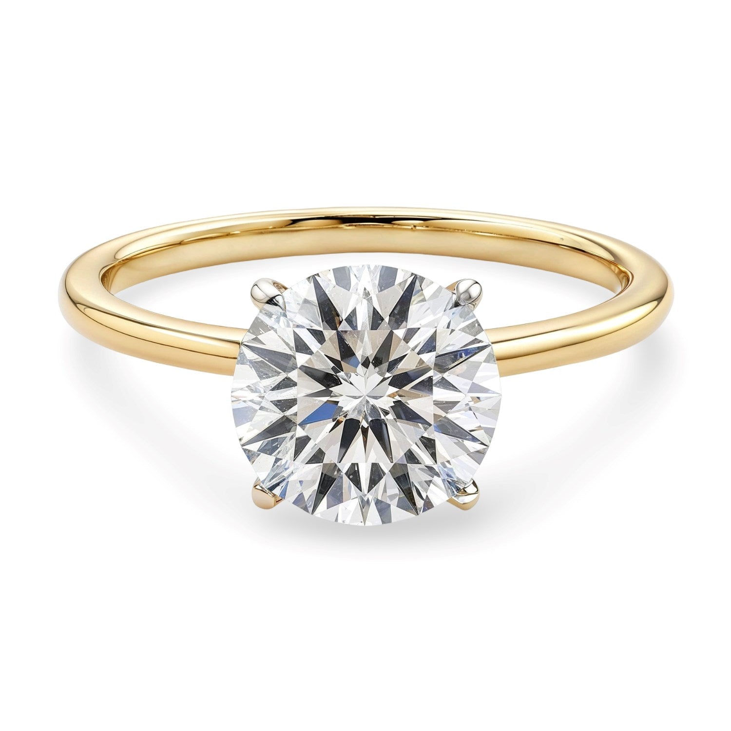 A round lab-grown diamond solitaire ring in 14K yellow gold with a four-prong setting.