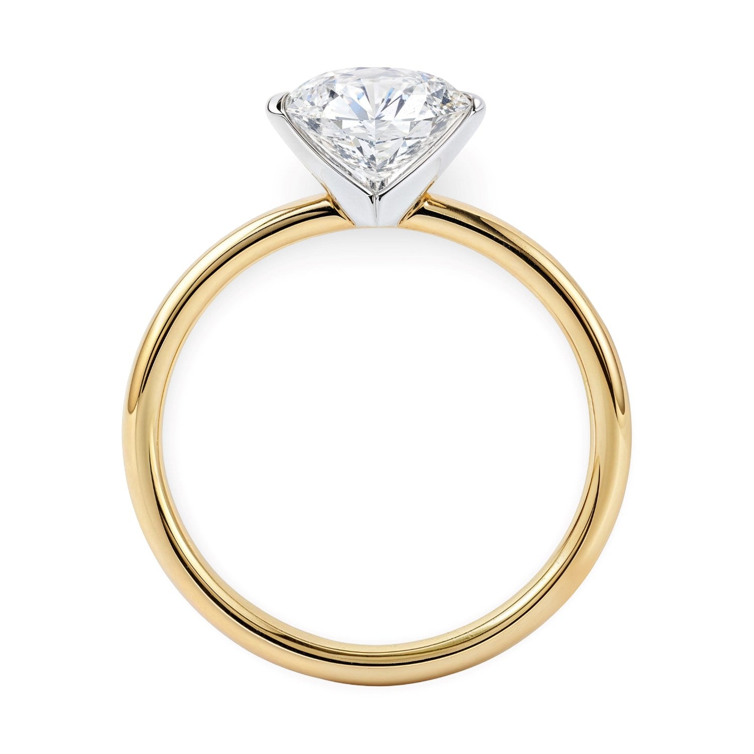 A round lab-grown diamond solitaire ring with a white gold head and yellow gold band.
