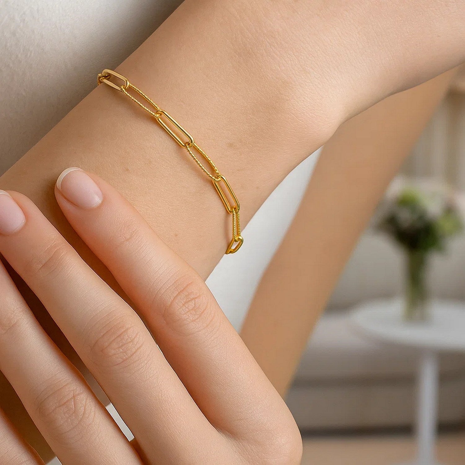 14k yellow gold alternating bead paperclip bracelet with a high polish finish.