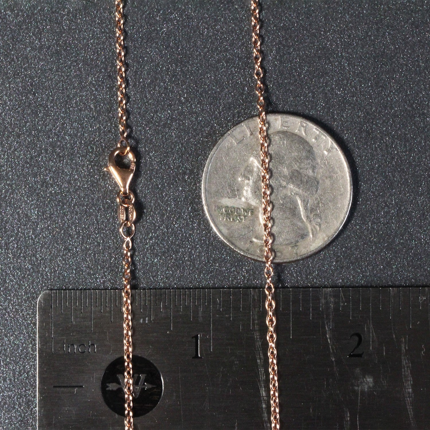 A 14k rose gold round cable link chain with a lobster clasp.