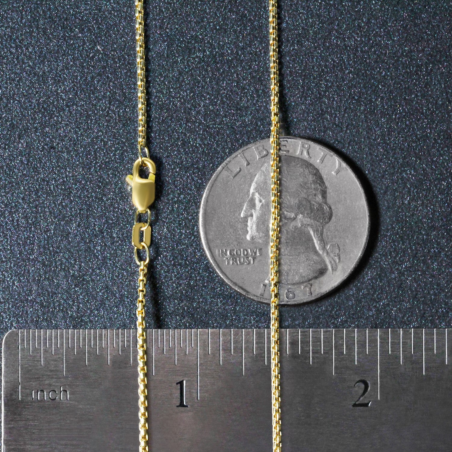 14k yellow gold round box chain with a lobster clasp, measured against a ruler and coin.