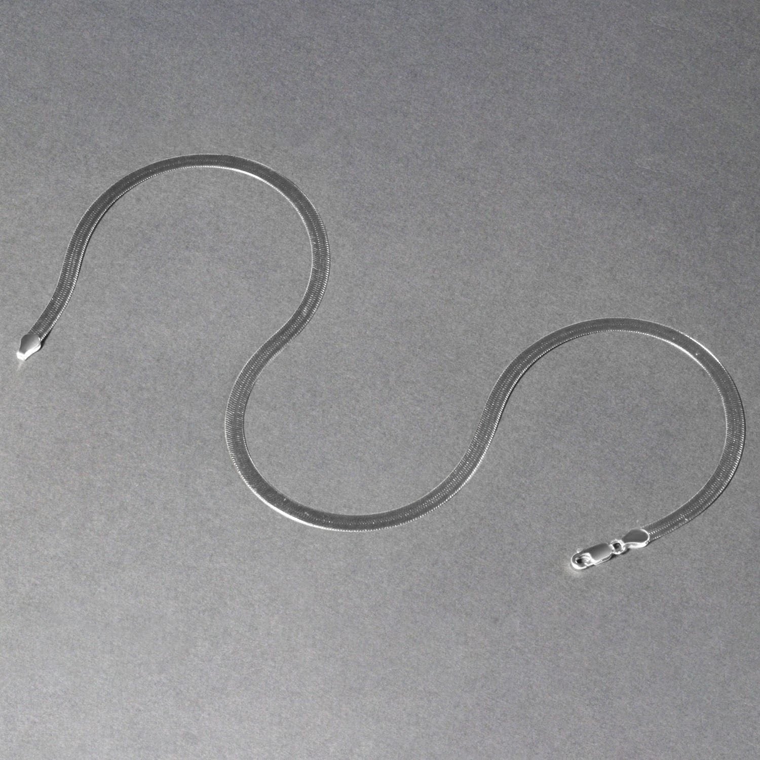A 14k white gold super flex herringbone chain with a lobster clasp.