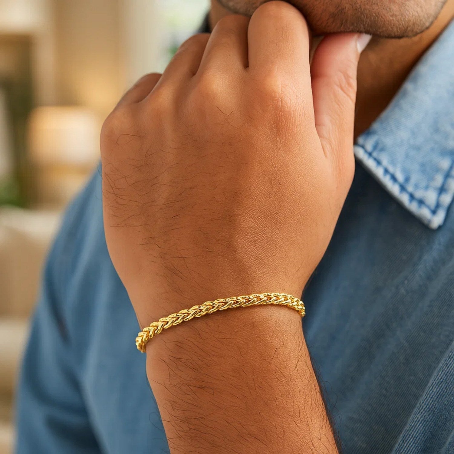 14k yellow gold diamond cut round franco bracelet on a person's wrist.