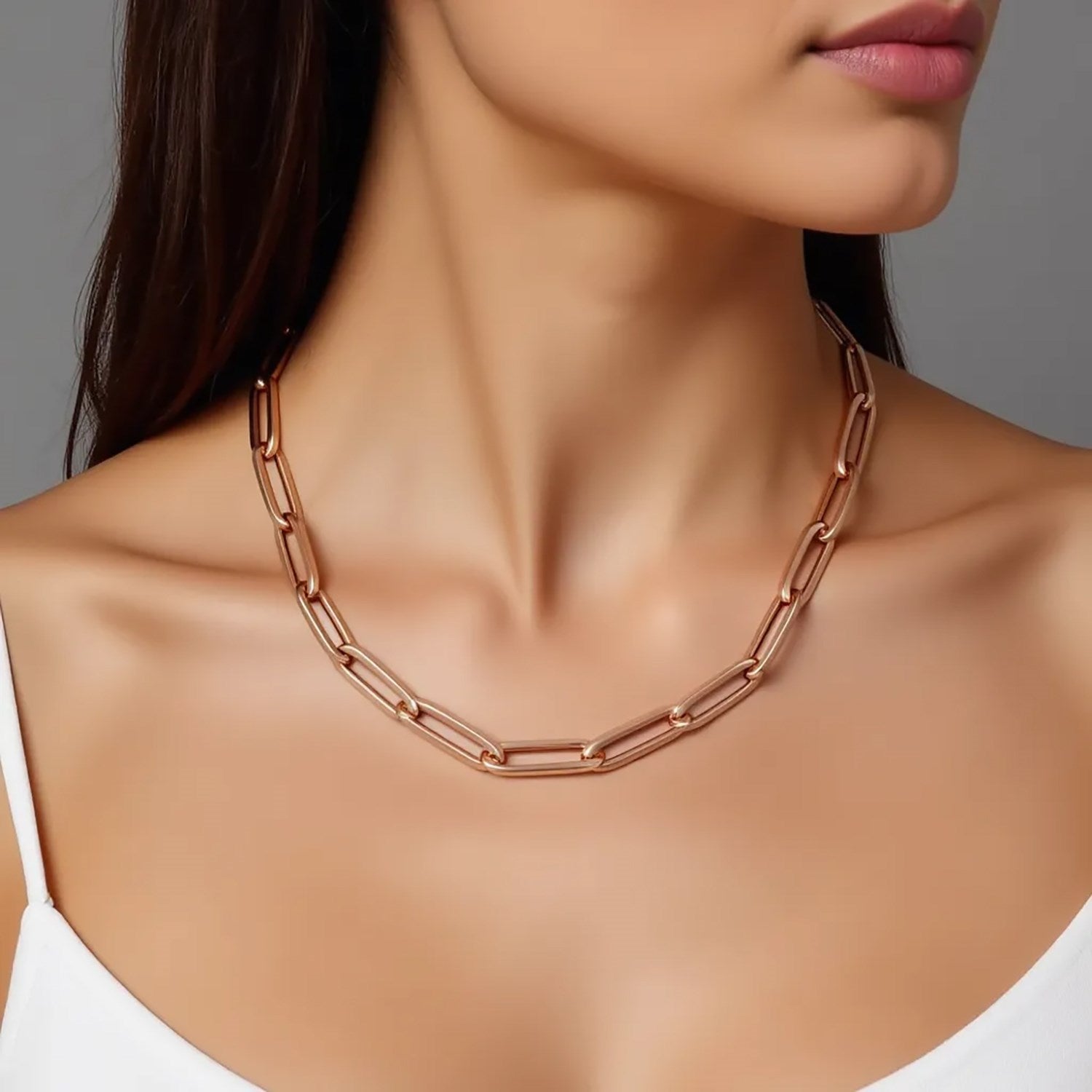 14K rose gold wide paperclip chain with 6.10 mm links on a model.