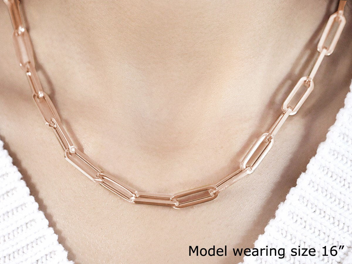14K rose gold wide paperclip chain with 6.10mm links on a model.