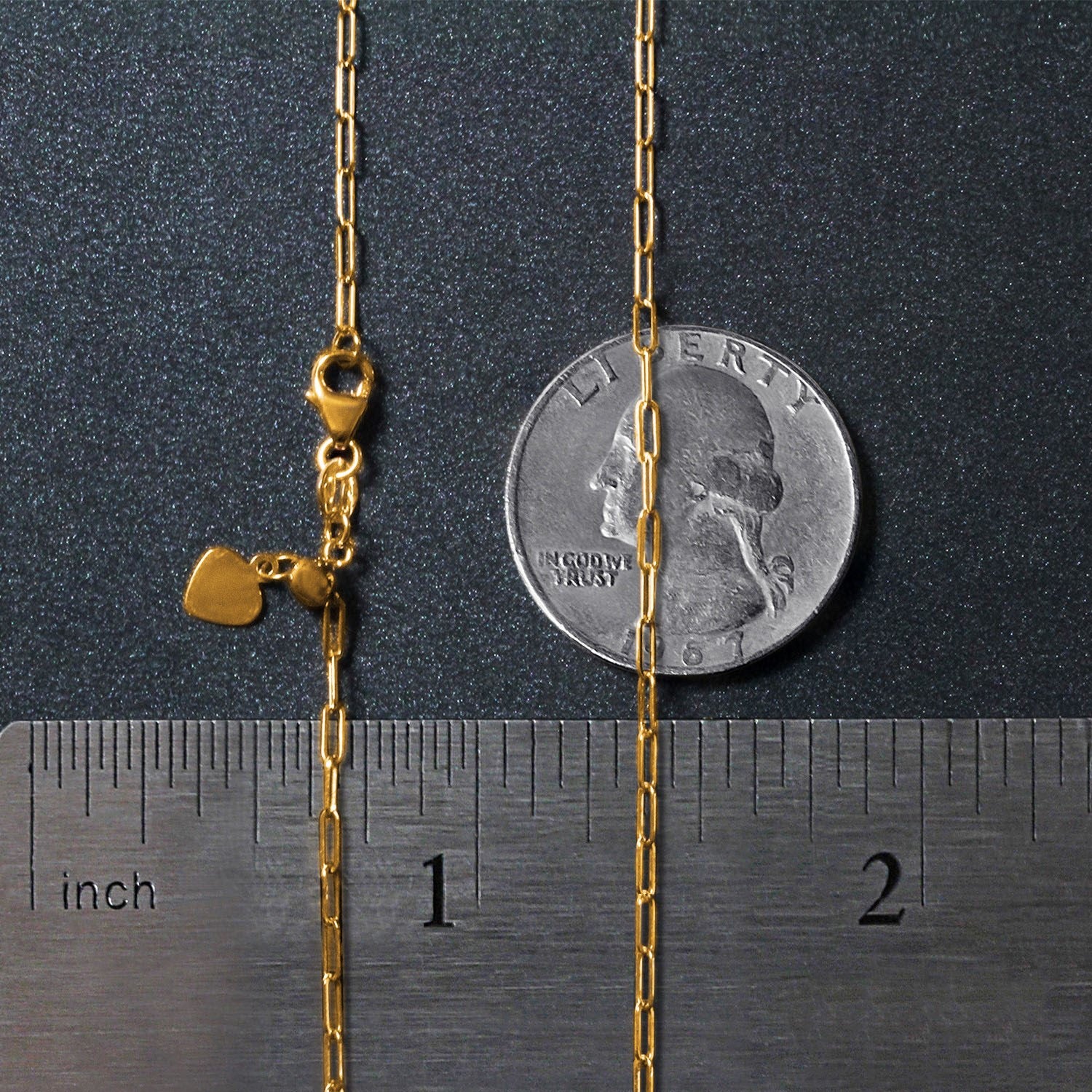 14k yellow gold adjustable paperclip chain with a heart dangle and lobster clasp.