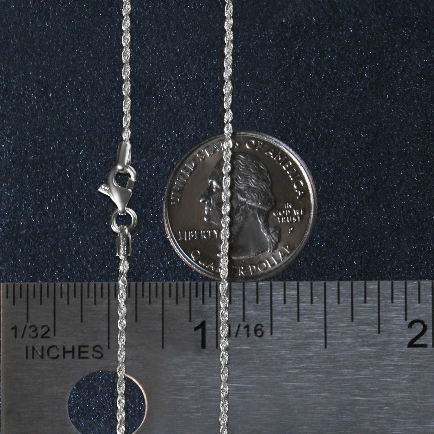 A 10k white gold solid diamond cut rope chain with a lobster clasp, shown with a ruler and coin for scale.