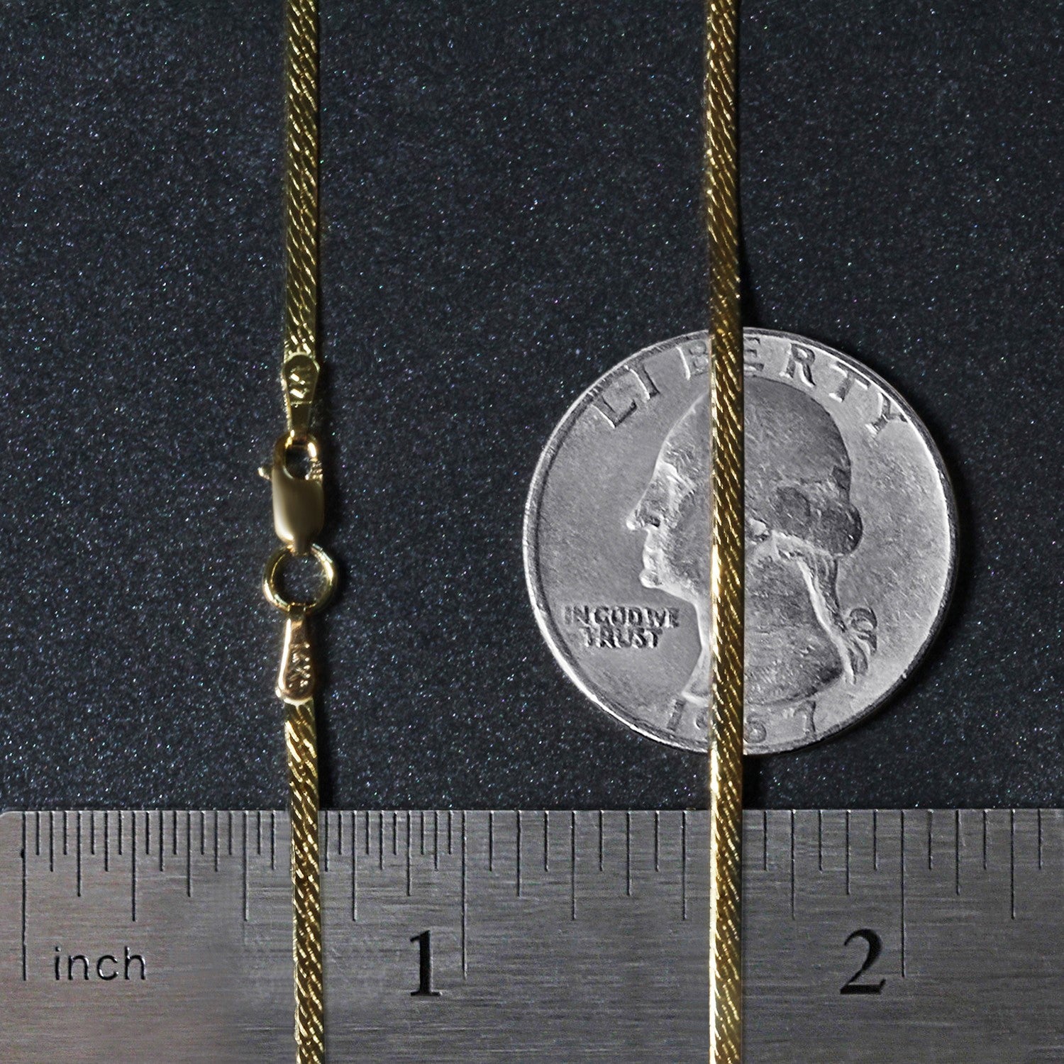 A 14k yellow gold super flex herringbone chain with a lobster clasp, measuring 1.50 mm wide.