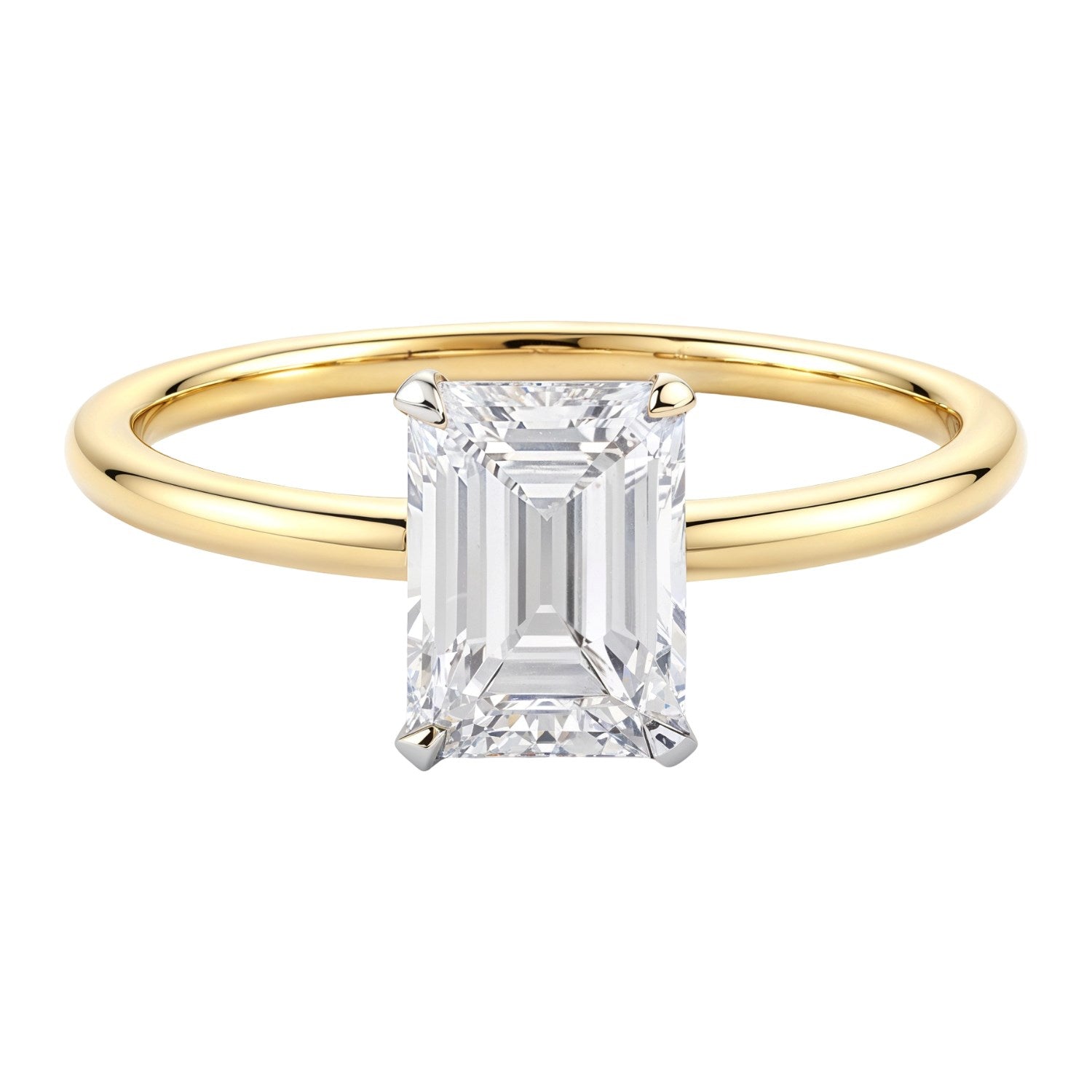 Emerald lab grown diamond ring with a yellow gold band and white gold prongs.