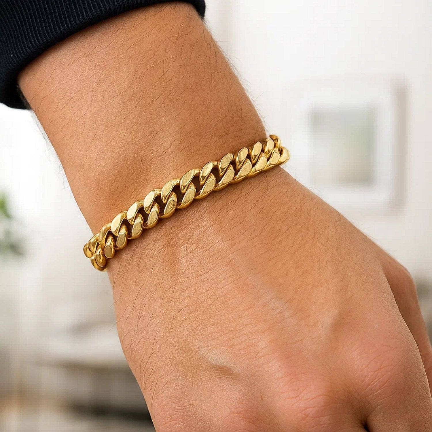 10k yellow gold semi-solid Miami Cuban bracelet on a person's wrist.