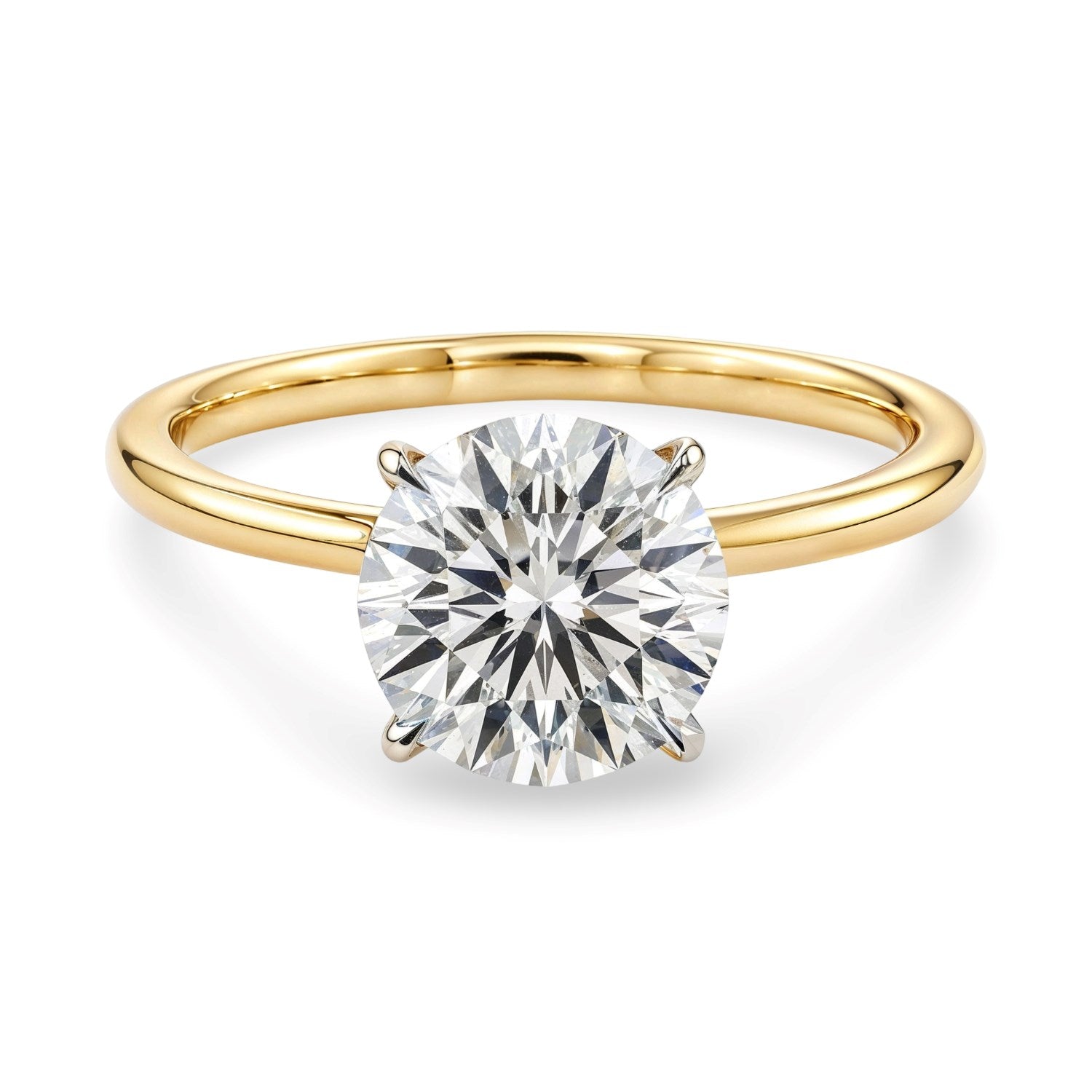 A 2 carat round lab grown diamond solitaire ring in 10K yellow gold.