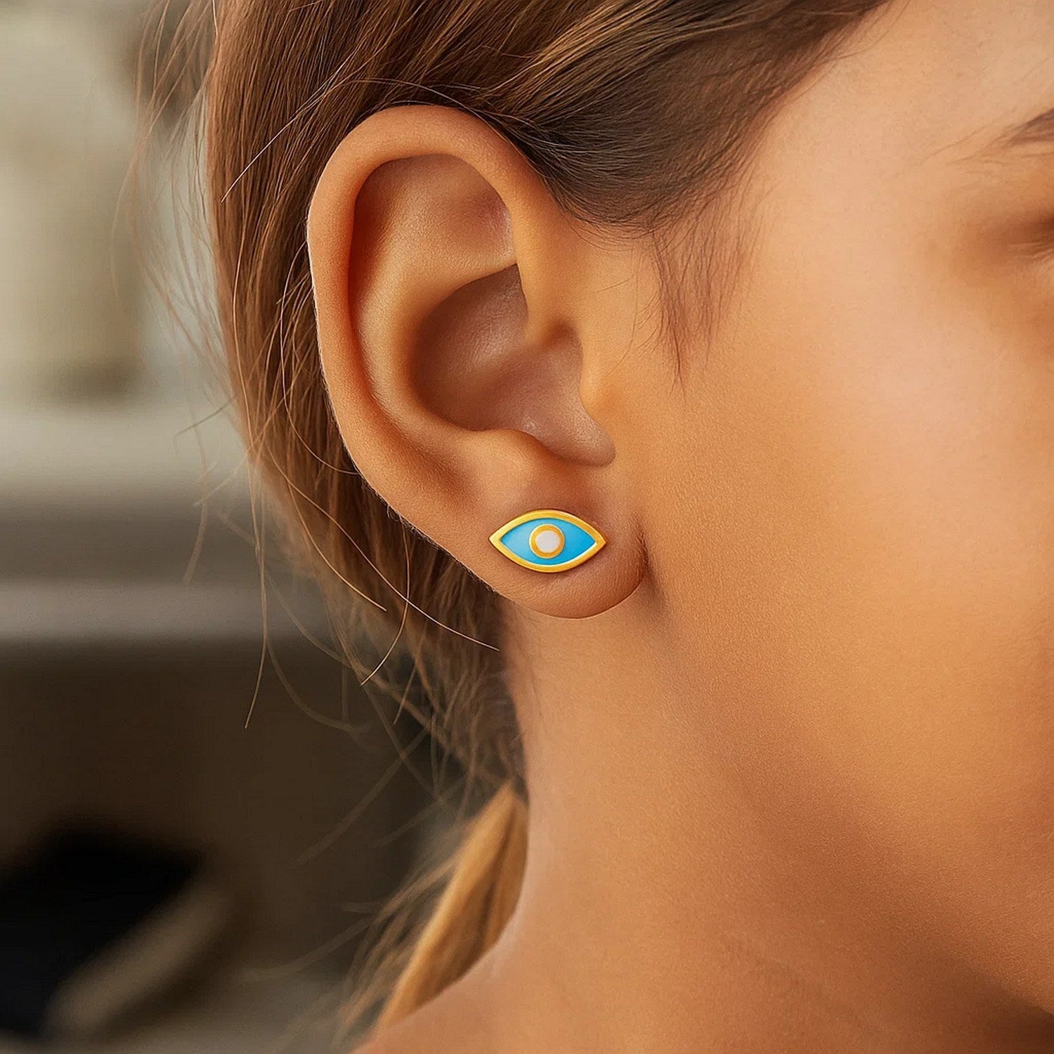 14K yellow gold blue evil eye enamel earrings with pushback clasps.