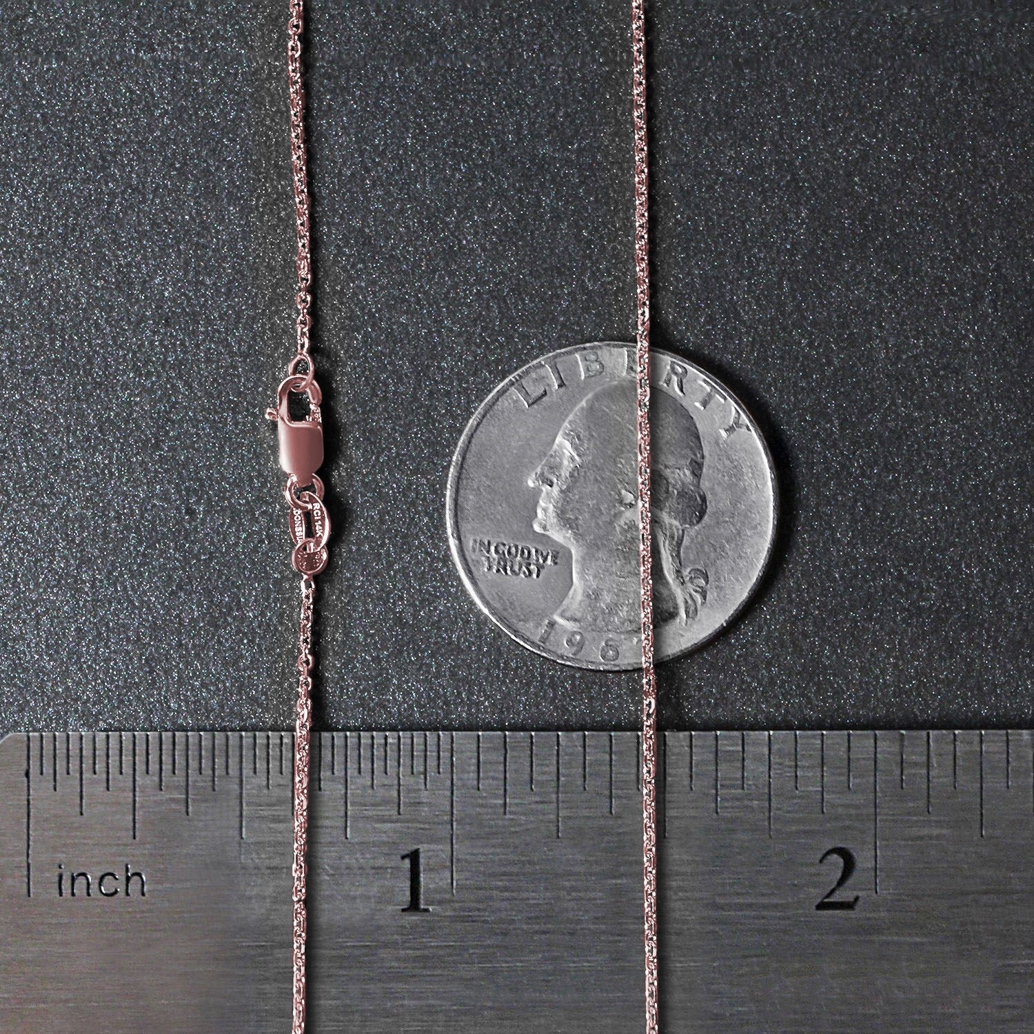 A 14k rose gold diamond cut cable link chain with a lobster clasp.