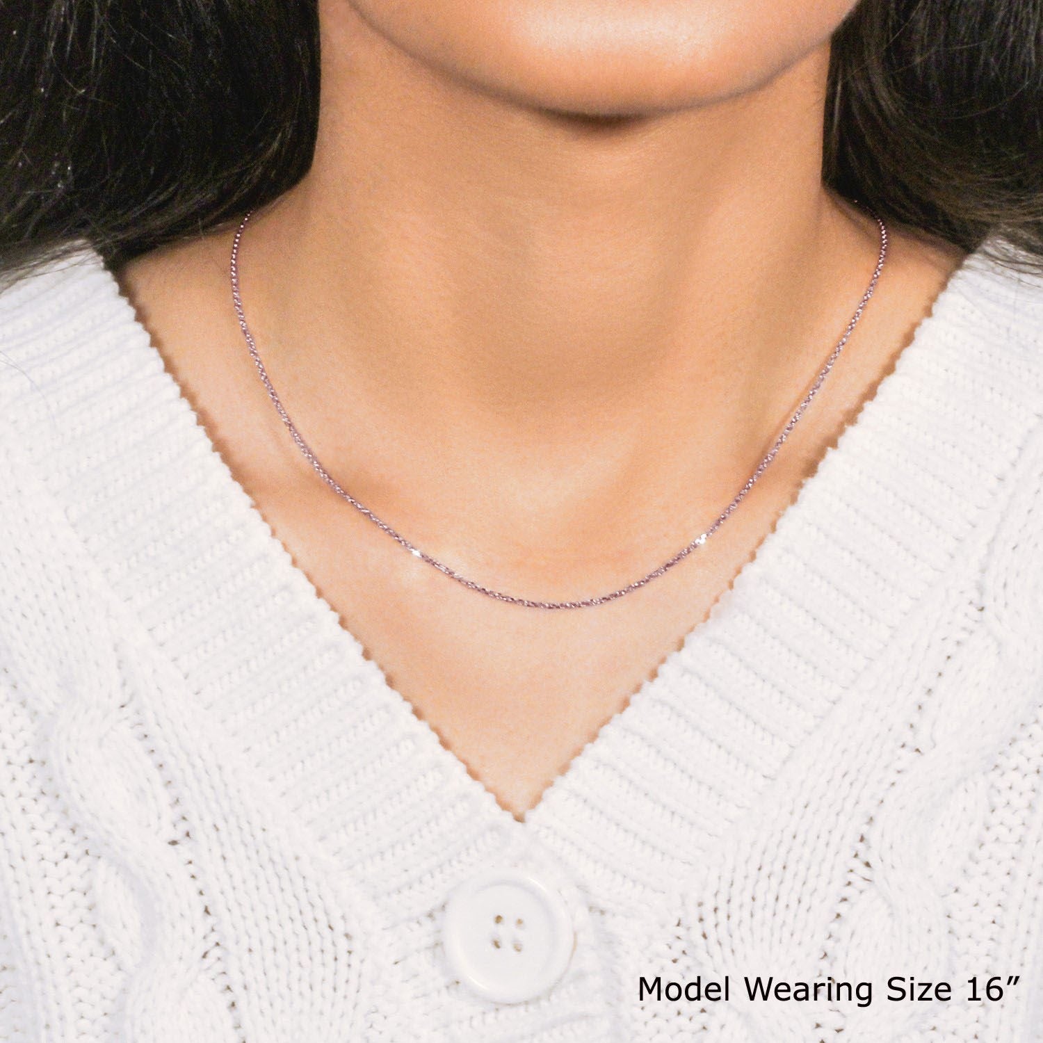 A 14k rose gold diamond-cut cable link chain, 1.10 mm wide, worn by a model.