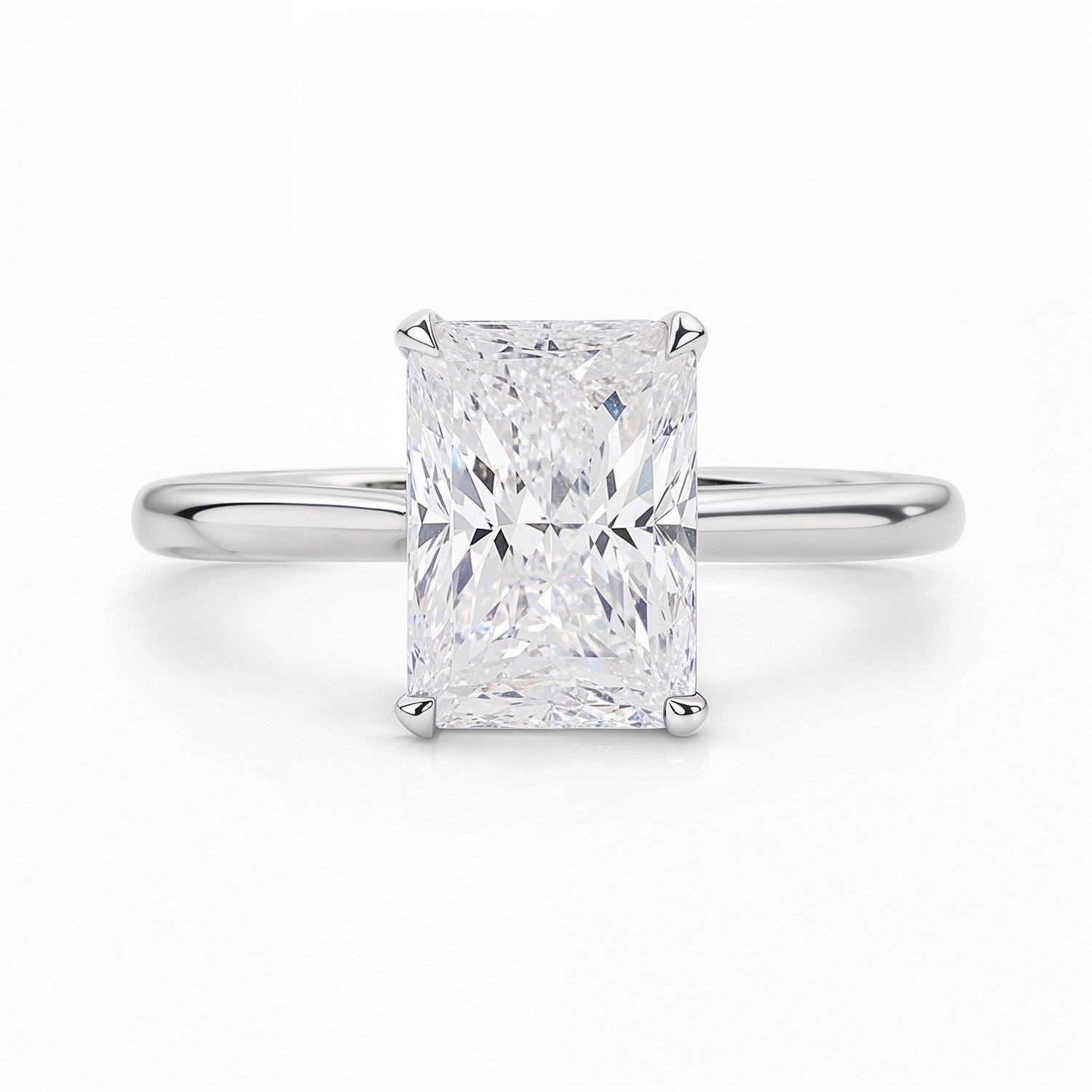 A radiant-cut lab-grown diamond solitaire ring in 14K white gold.