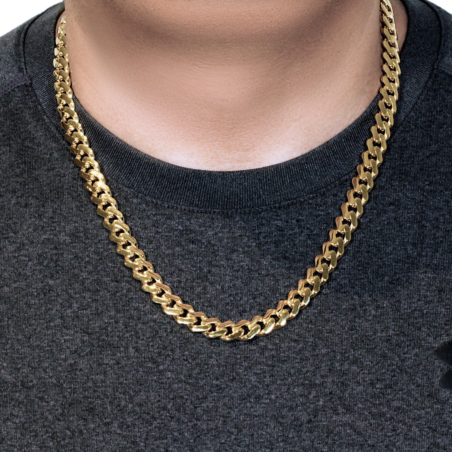 14k yellow gold 22-inch polished curb chain necklace on a person.