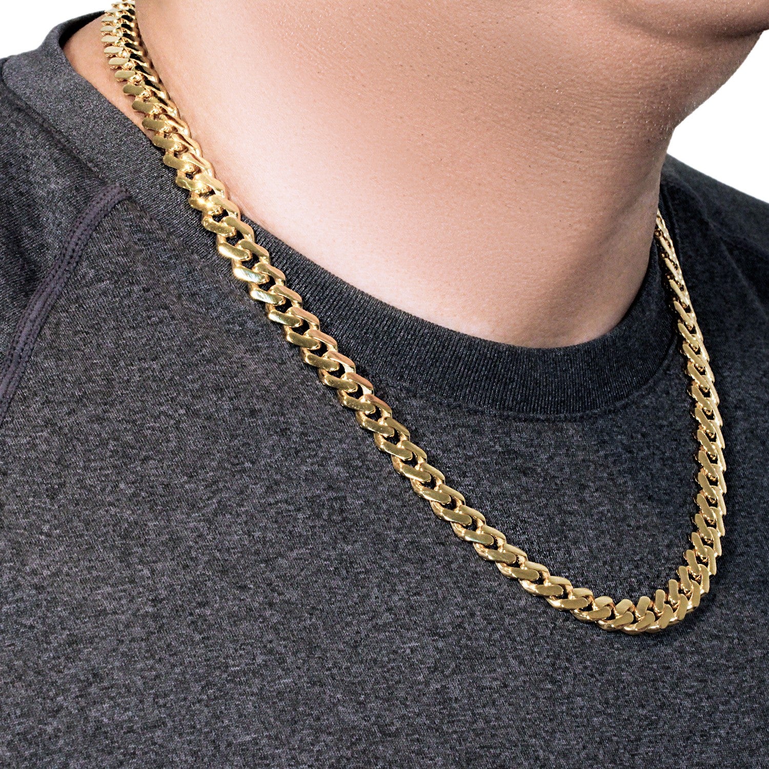 14k yellow gold 22-inch polished curb chain necklace on a person wearing a gray shirt.