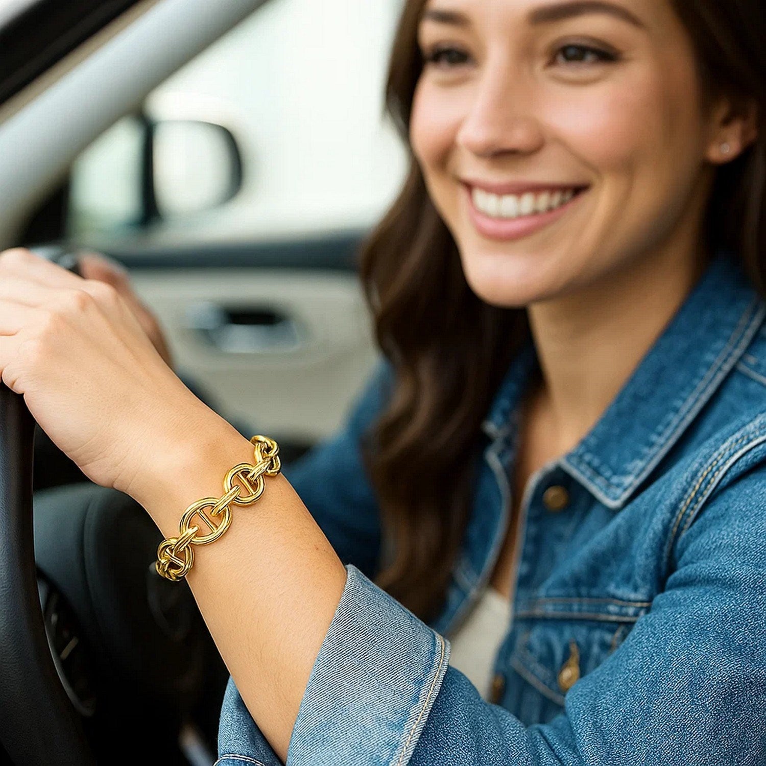 14k yellow gold high polish mariner link bracelet on a woman's wrist.