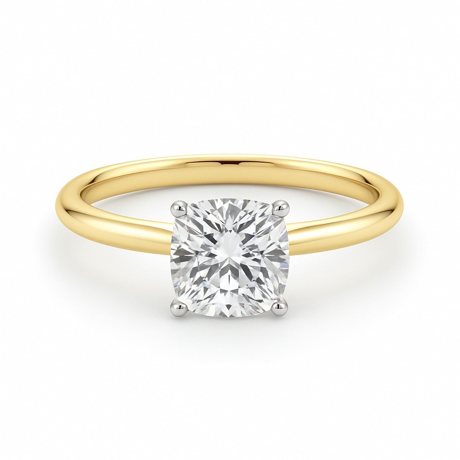 A cushion-cut lab-grown diamond ring with a yellow gold band and white gold prongs.