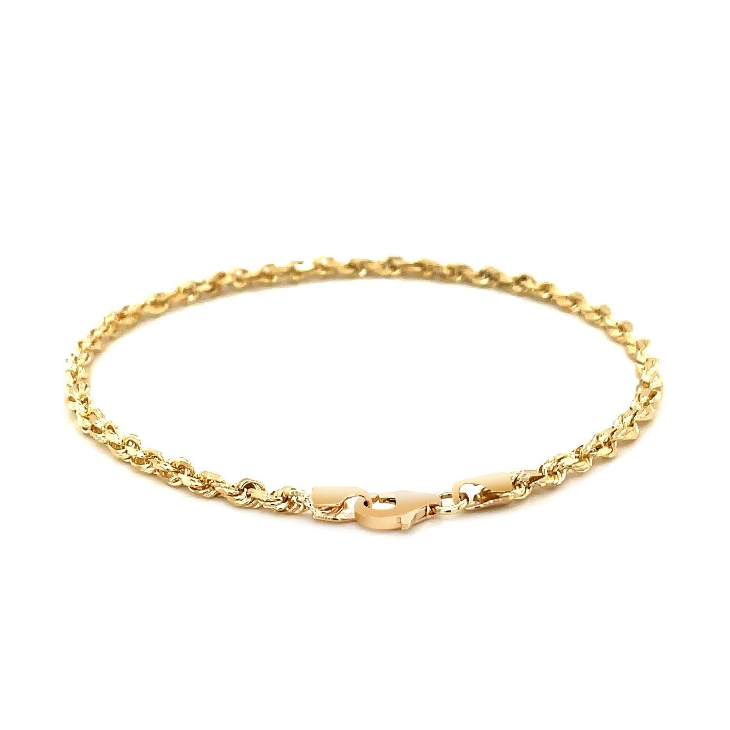 A 10k yellow gold solid diamond cut rope bracelet with a lobster clasp.