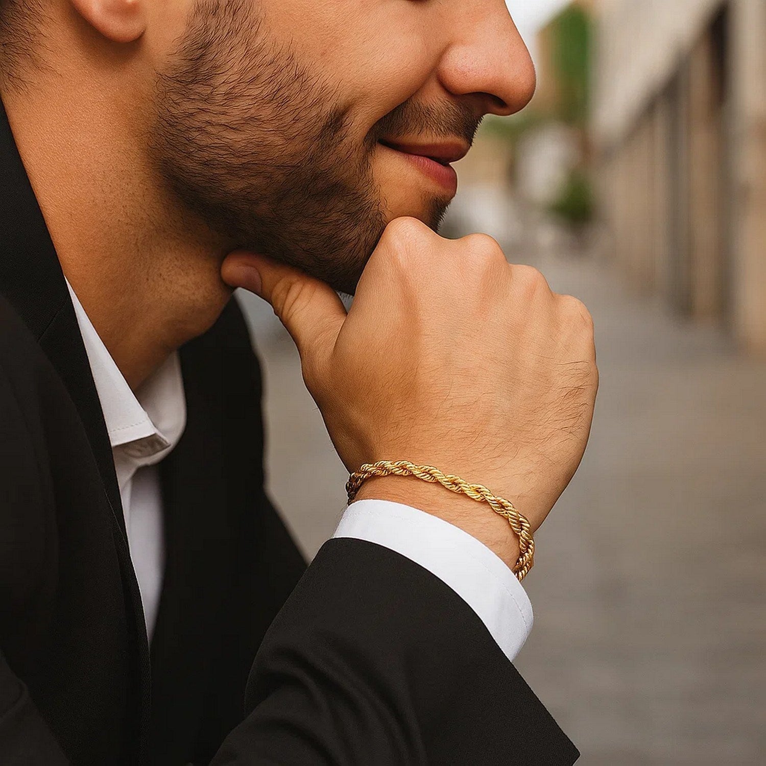 10k yellow gold solid diamond cut rope bracelet on a man's wrist.