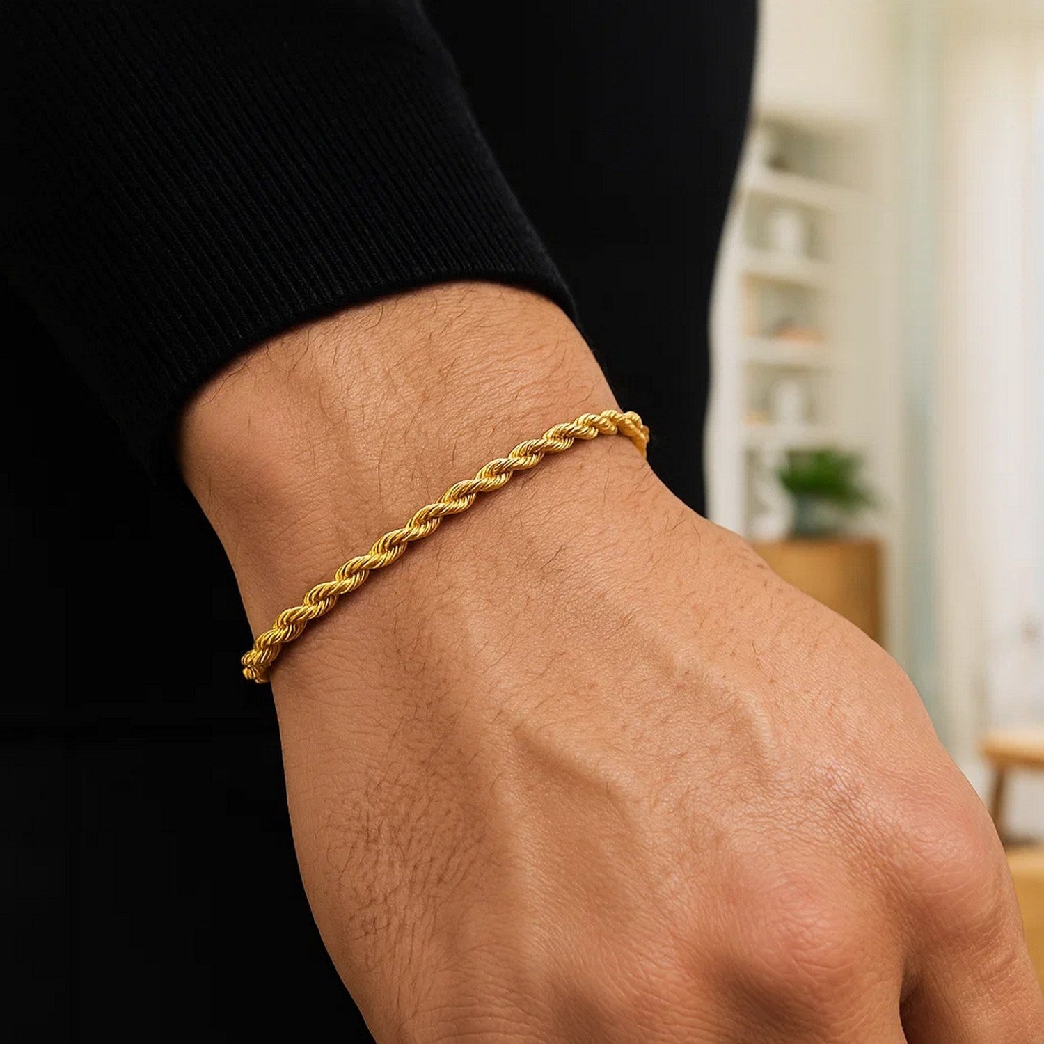 A 10k yellow gold solid diamond cut rope bracelet on a person's wrist.
