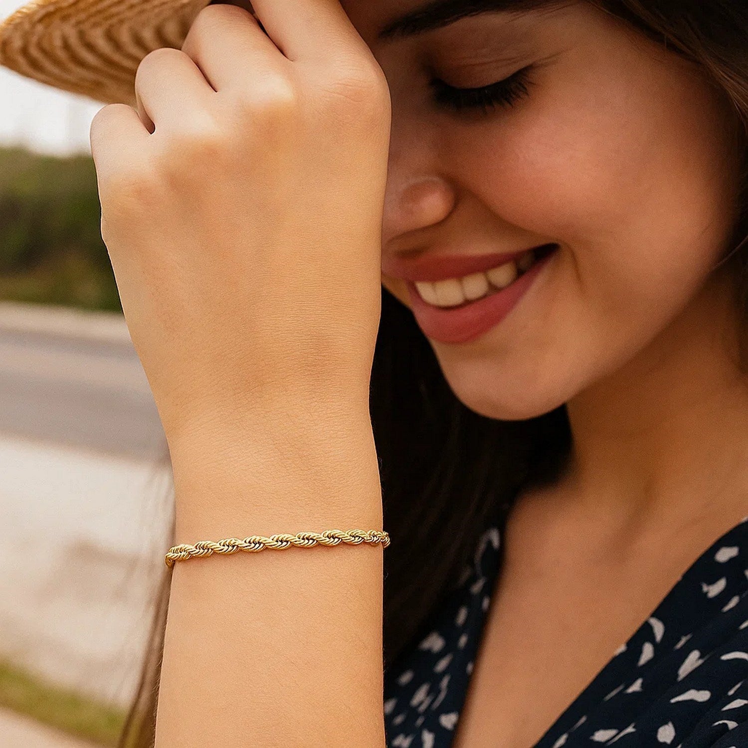 10k yellow gold solid diamond cut rope bracelet on a woman's wrist.
