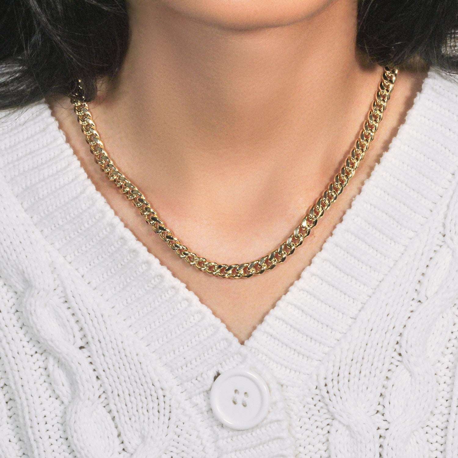 14k yellow gold semi-solid Miami Cuban chain, 6.60 mm wide, on a person.
