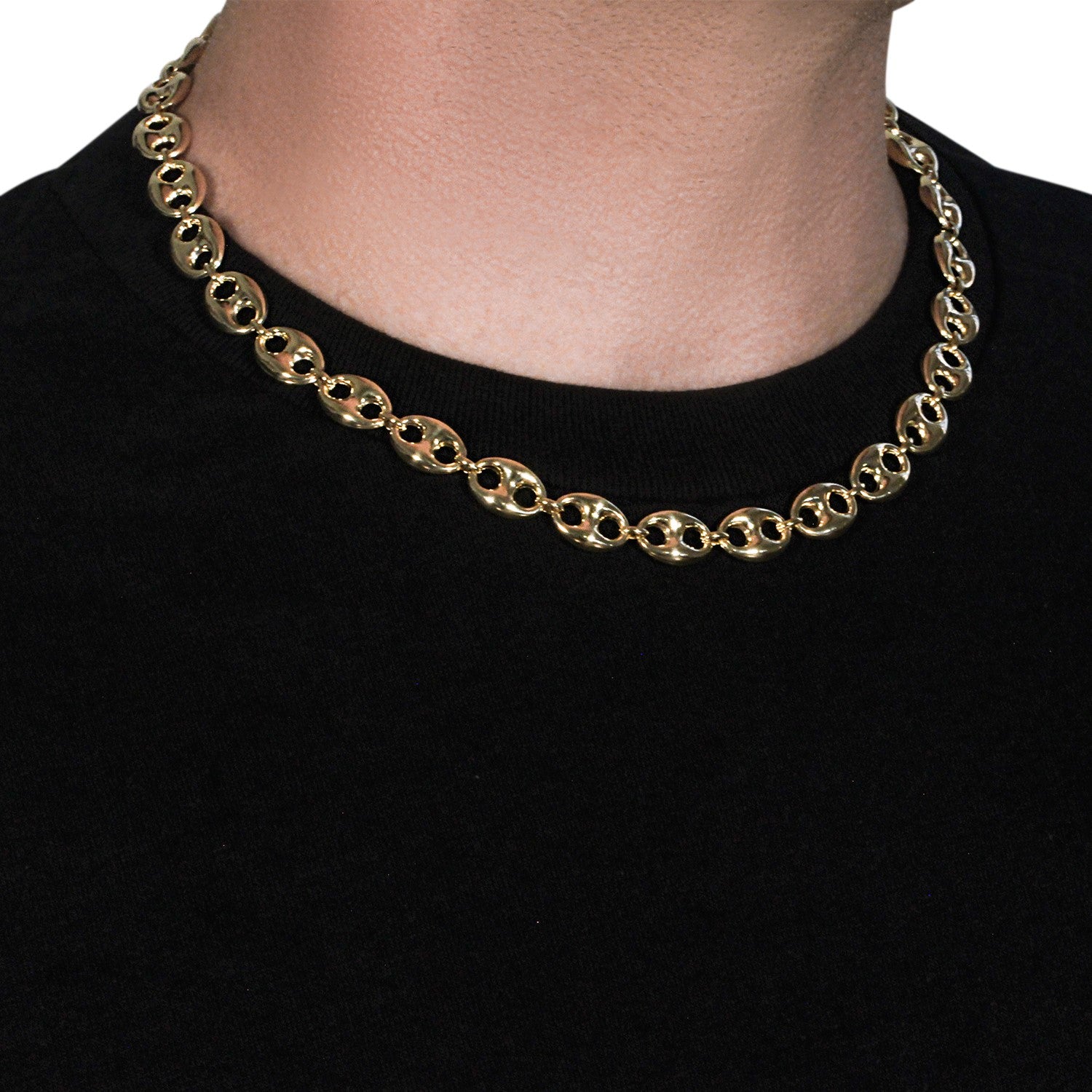 14k yellow gold puffed mariner link chain on a person's neck.