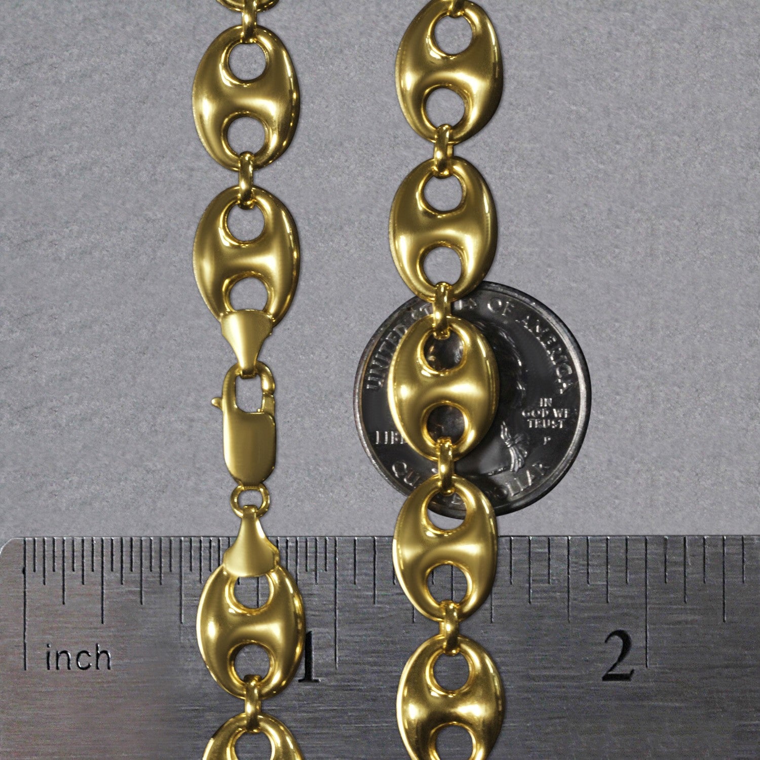 14k yellow gold puffed mariner link chain, 11mm wide, with a lobster clasp.