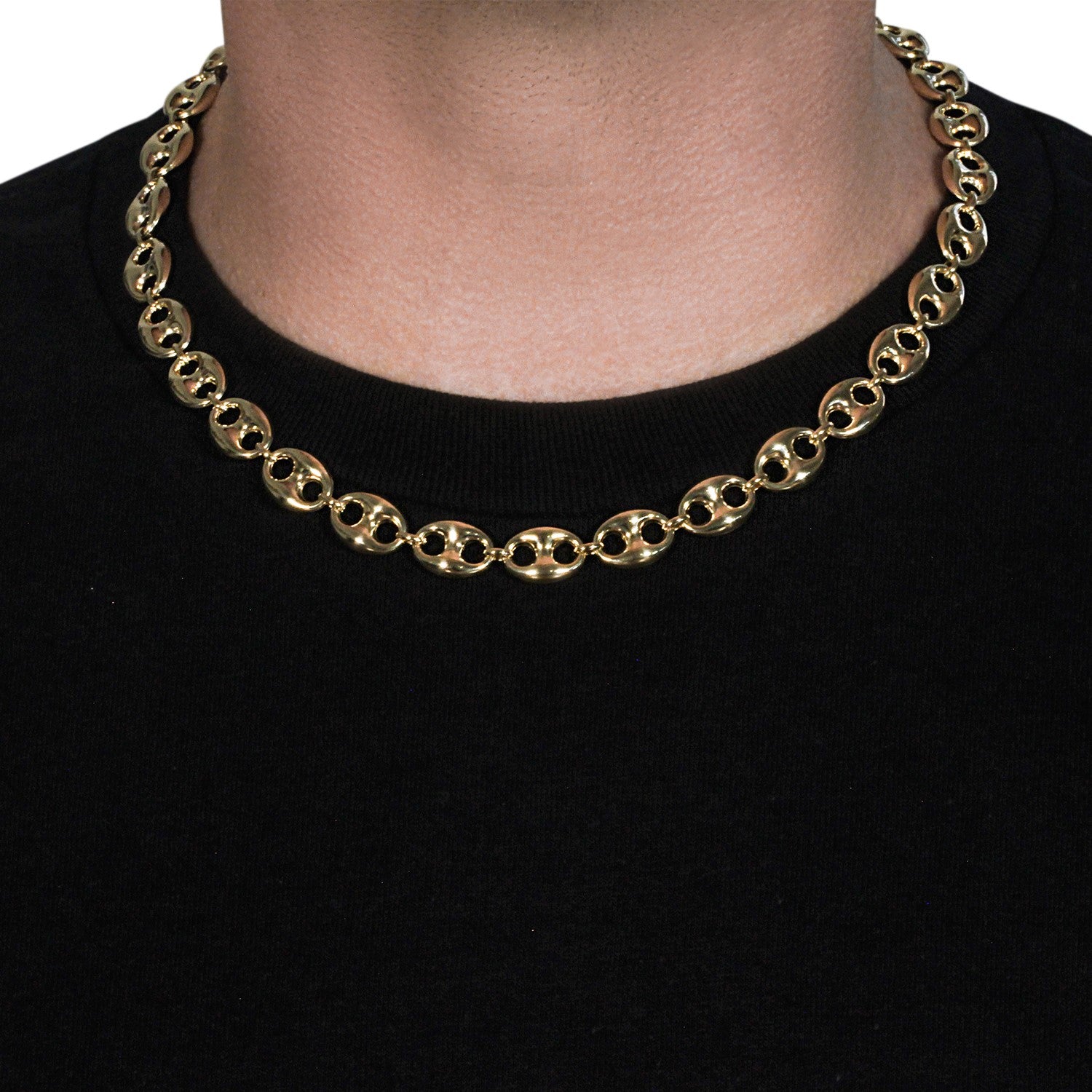 14k yellow gold puffed mariner link chain on a person's neck.